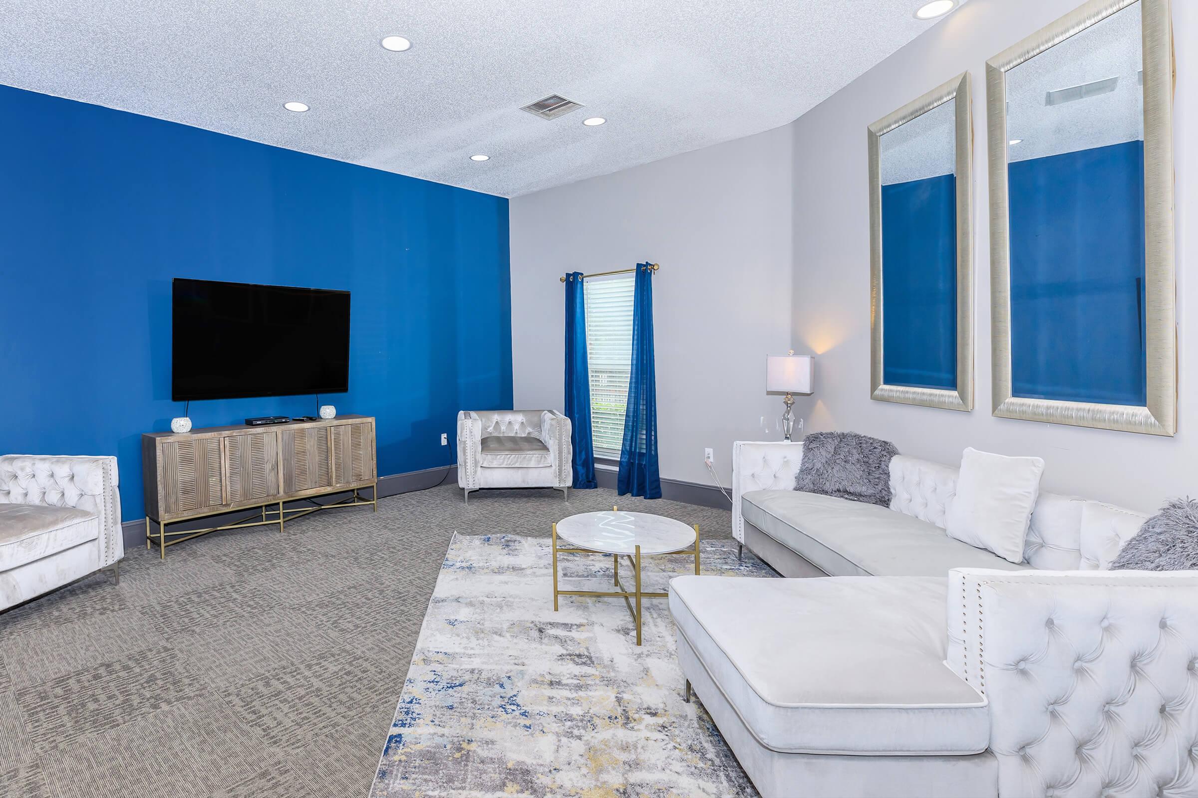 a living room with blue walls