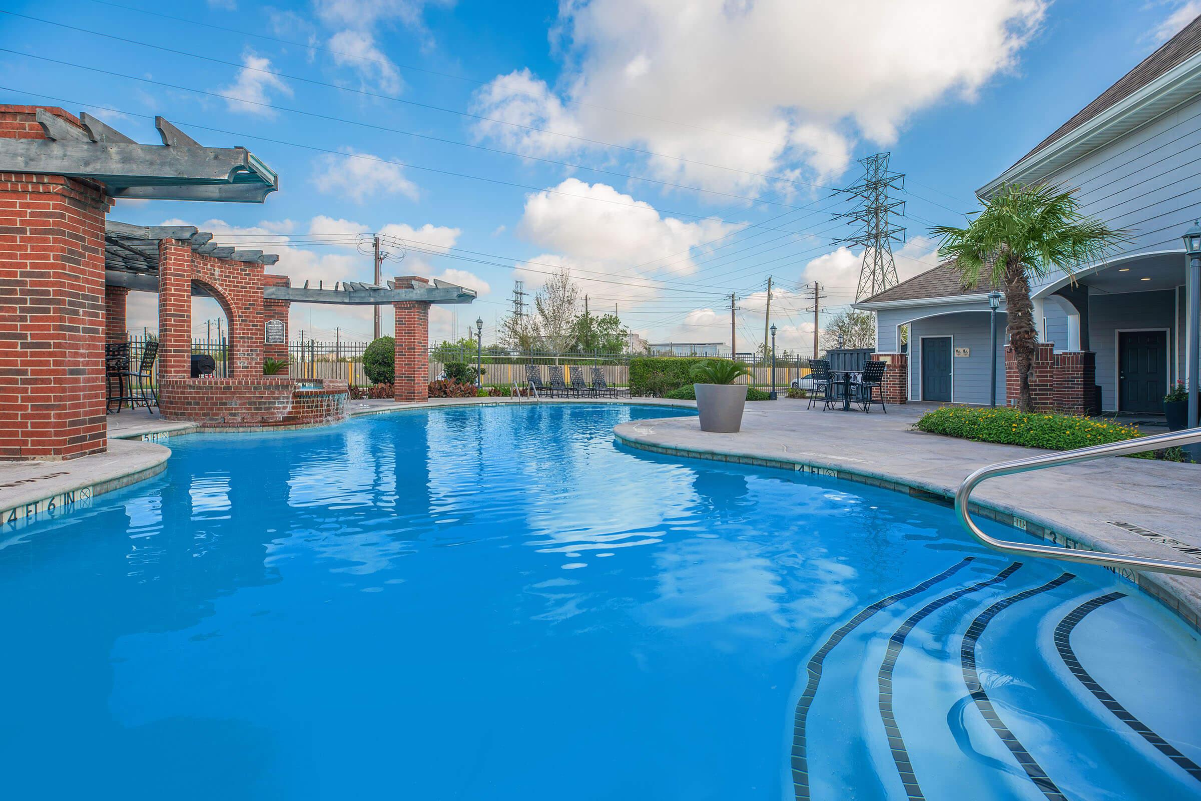 a house with a large pool of water