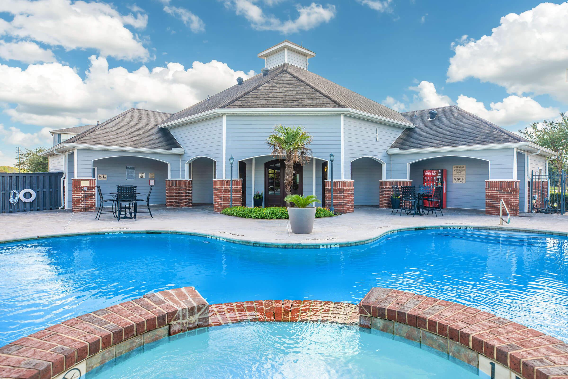 a house with a large pool of water