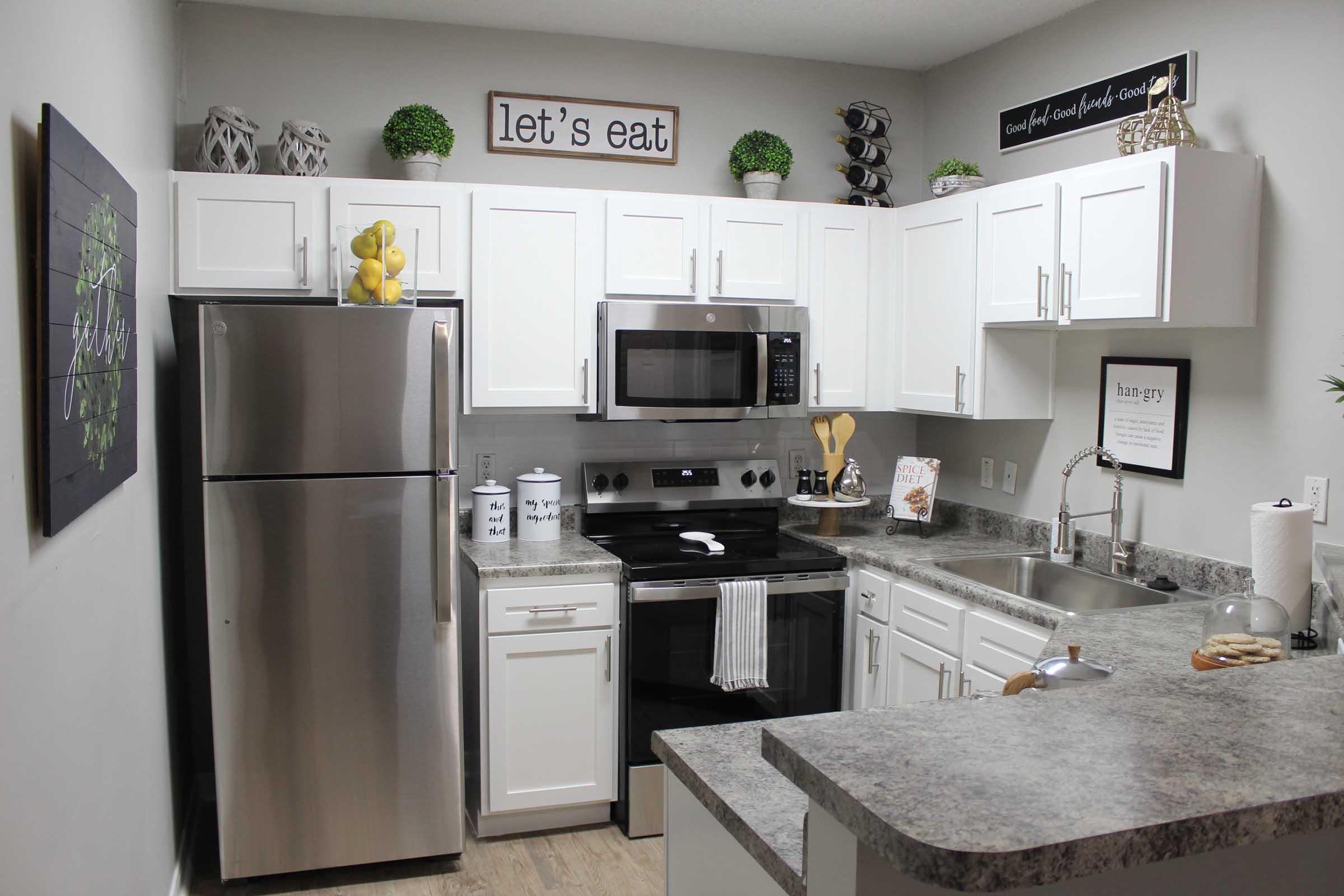 a kitchen with a stove and a refrigerator