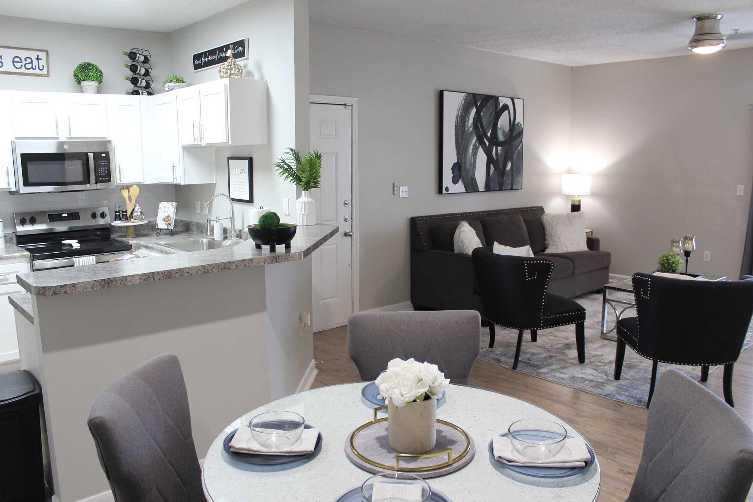 a living room filled with furniture and a table