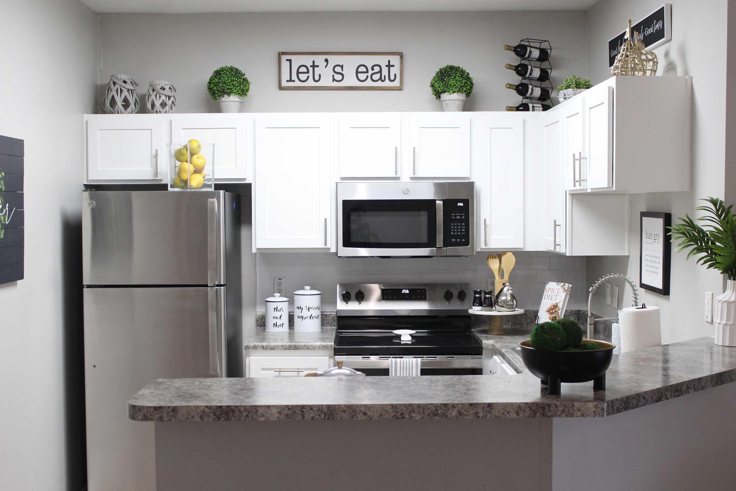 a kitchen with a sink and a microwave