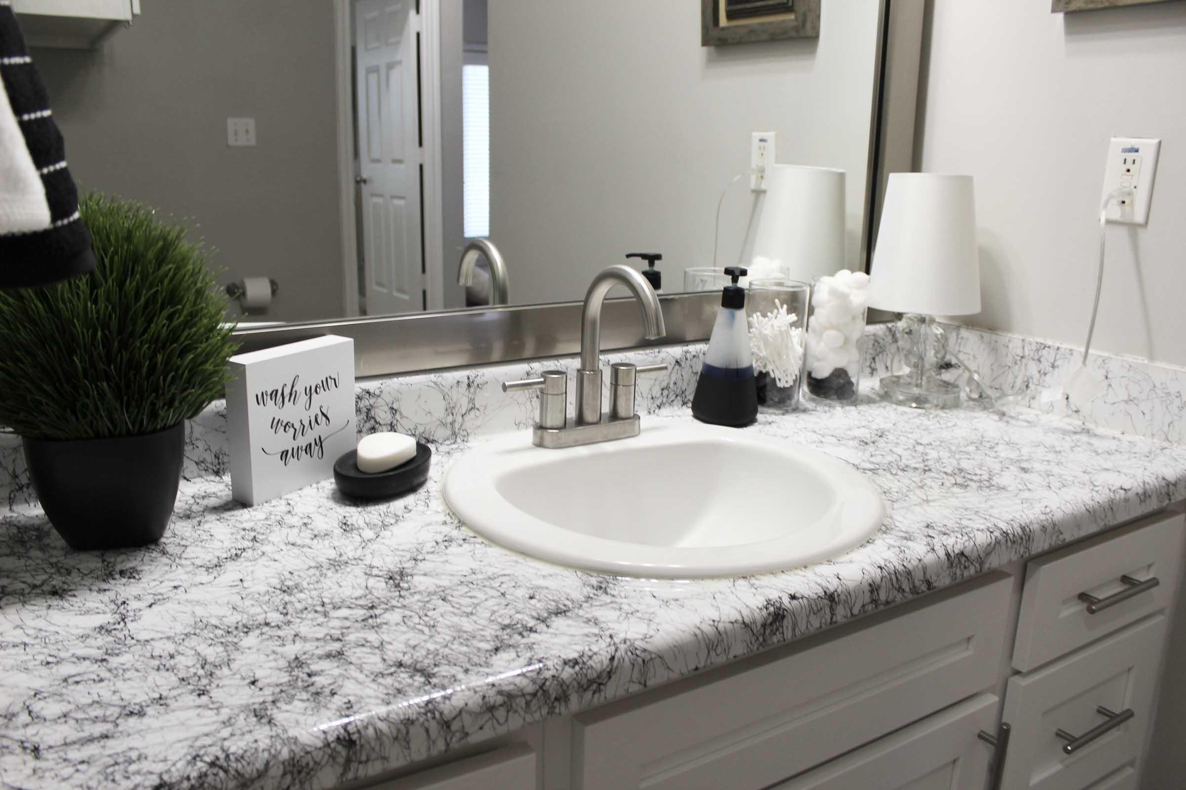 a double sink and large mirror