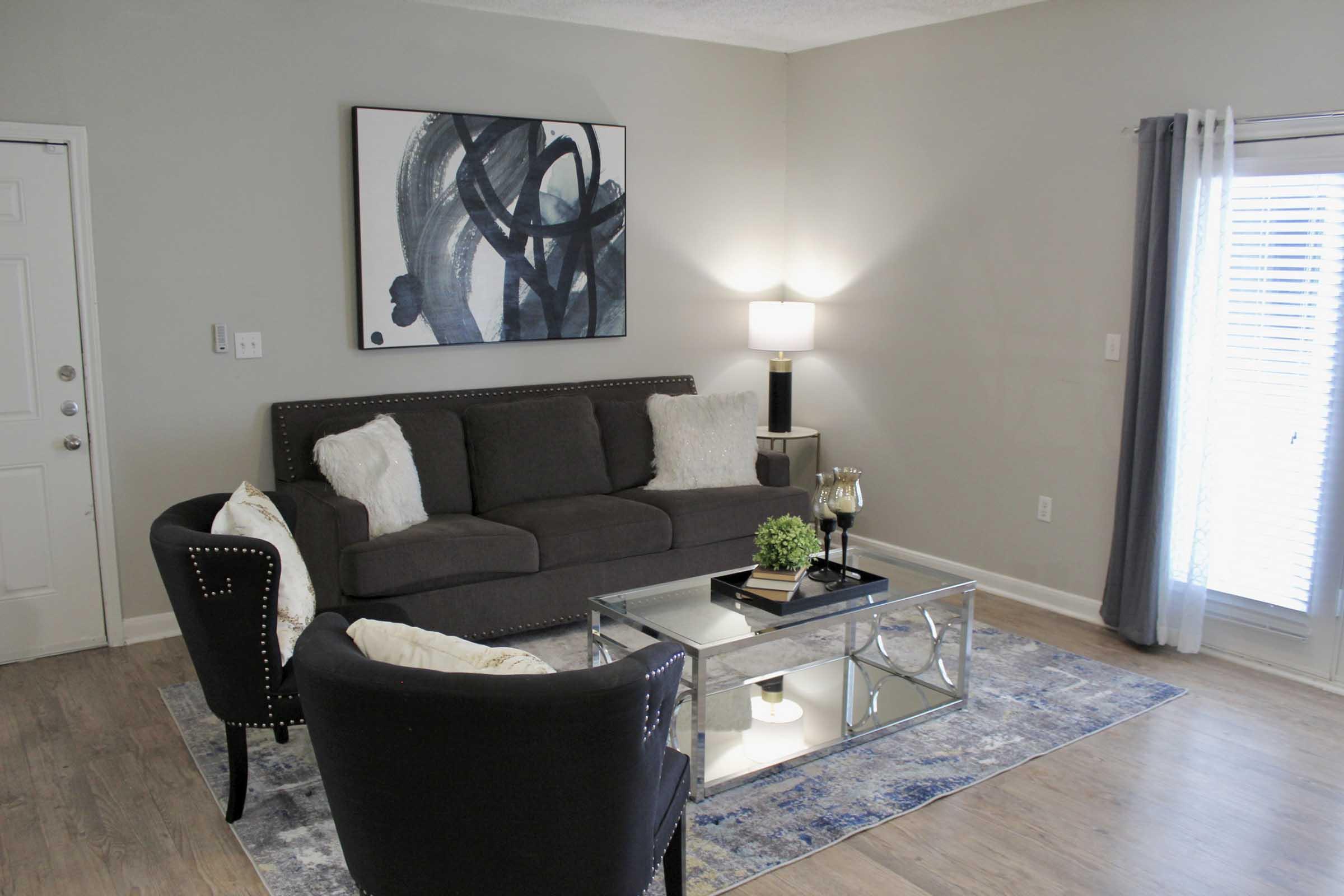 a living room with a sink and a window