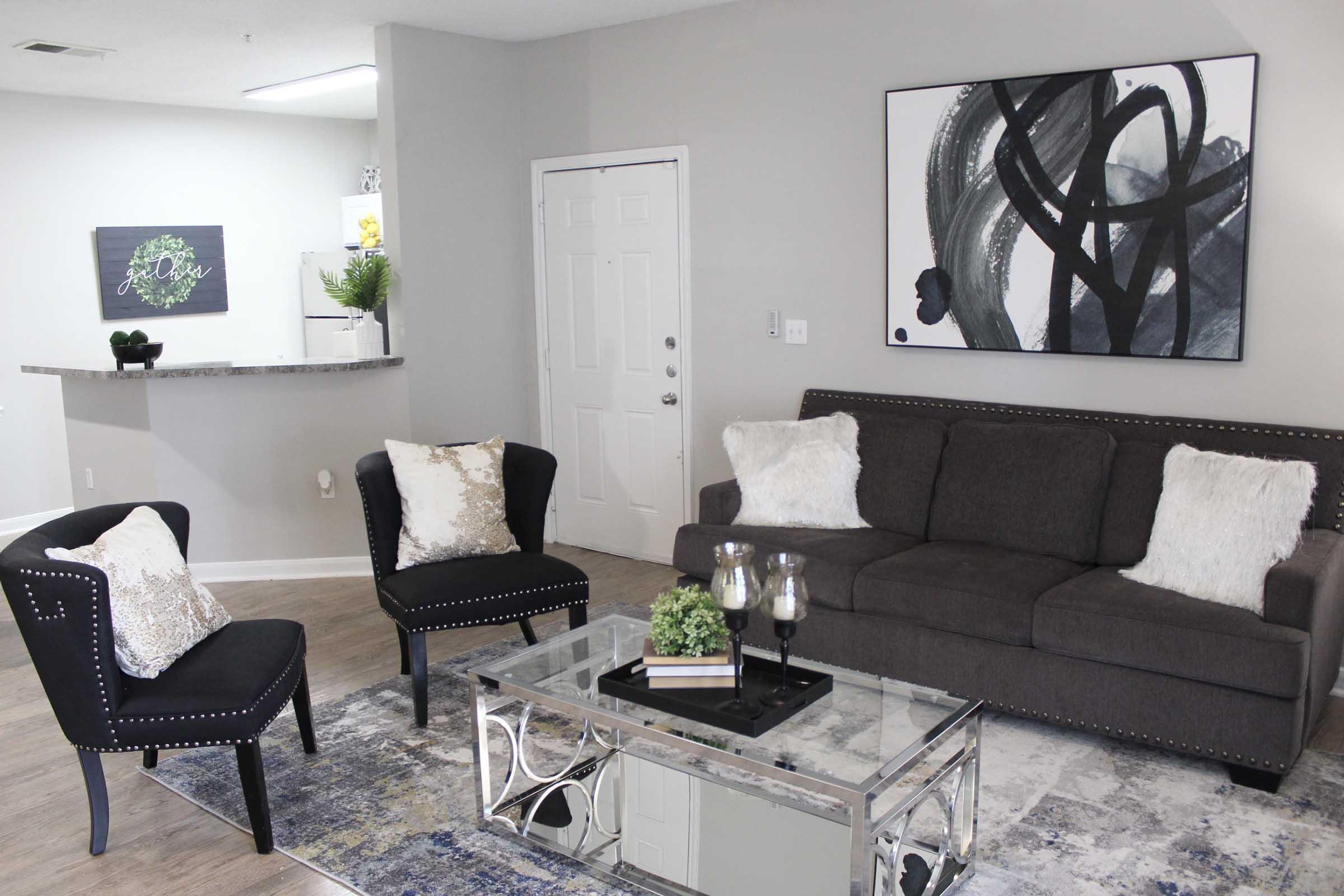 a living room filled with furniture and a table