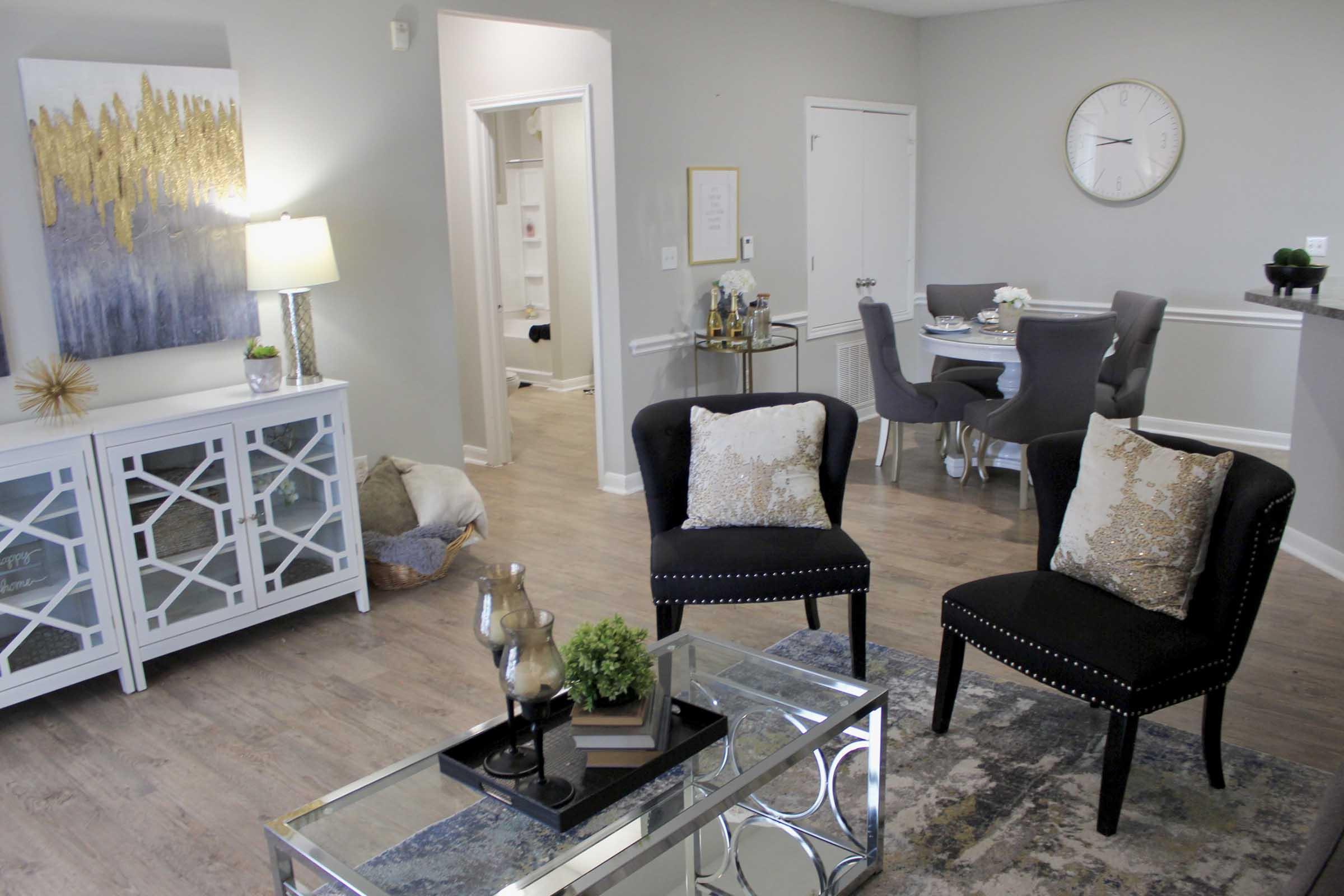 a living room filled with furniture and a fireplace