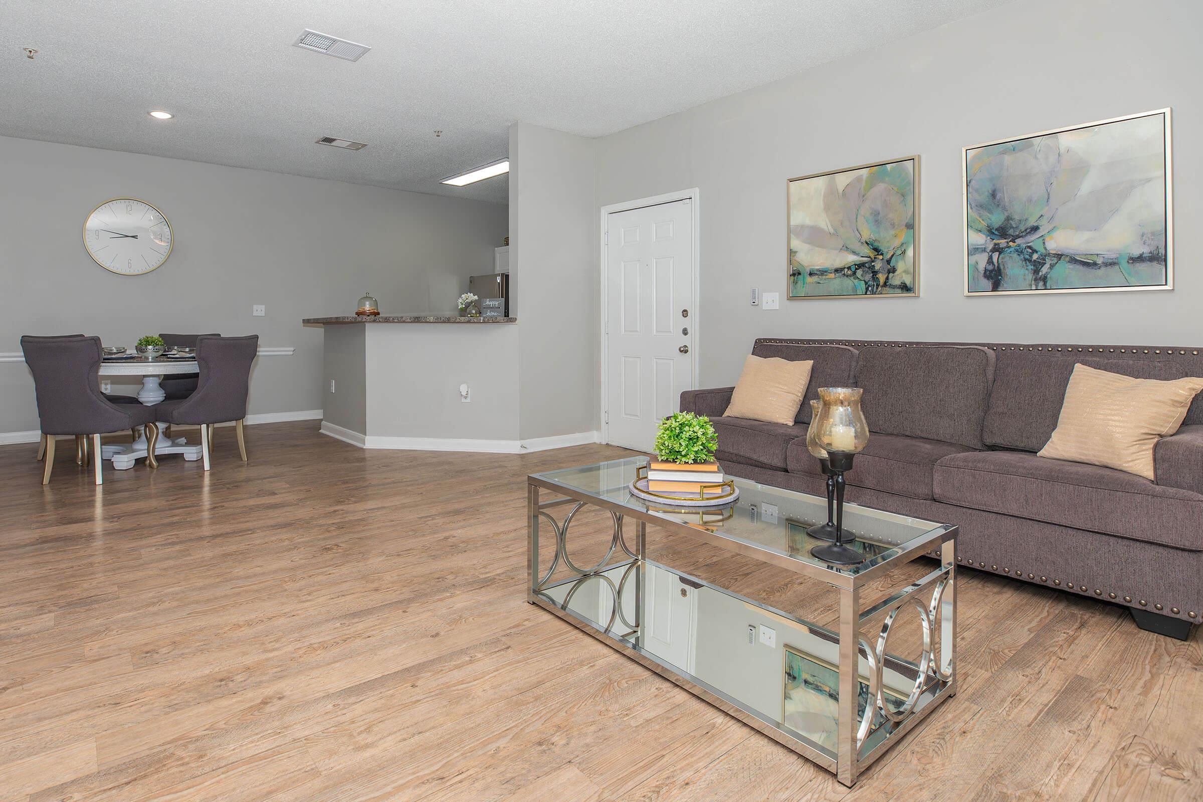 a living room filled with furniture and a tv