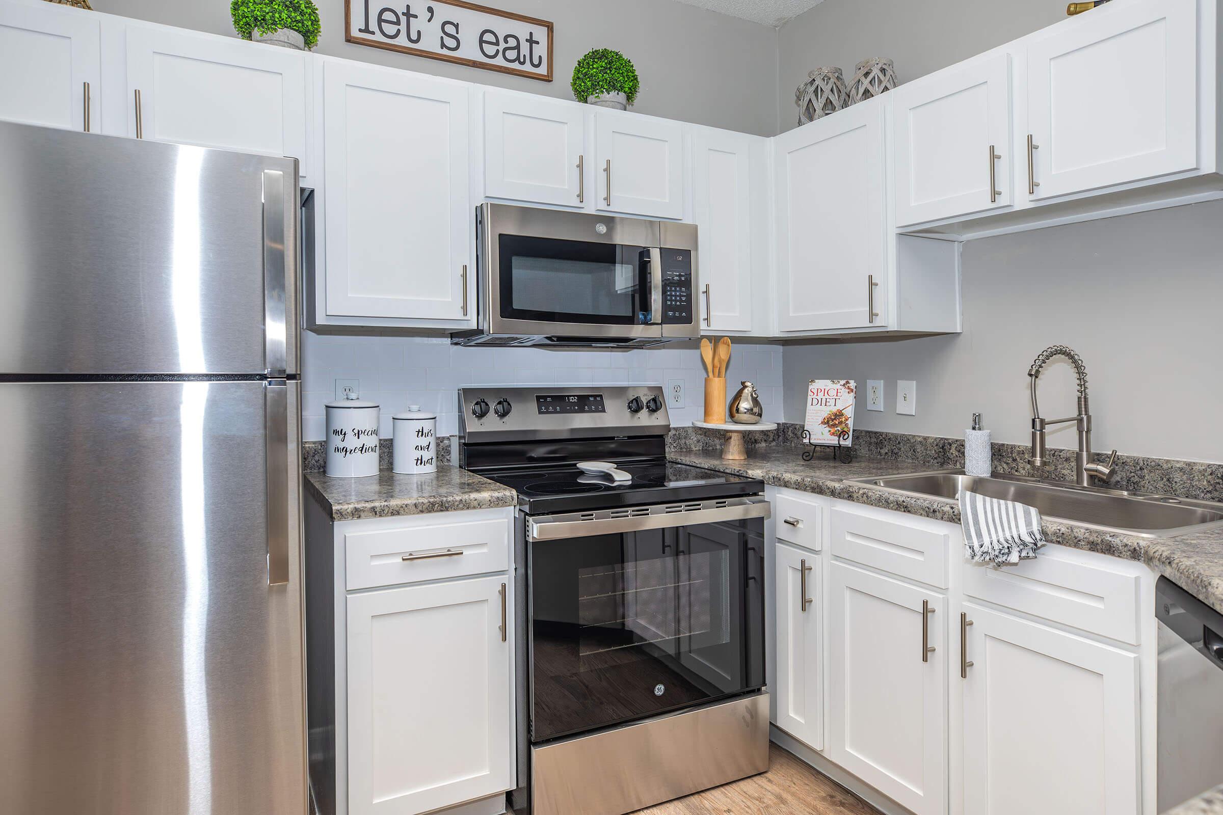 a kitchen with a stove top oven sitting inside of a refrigerator