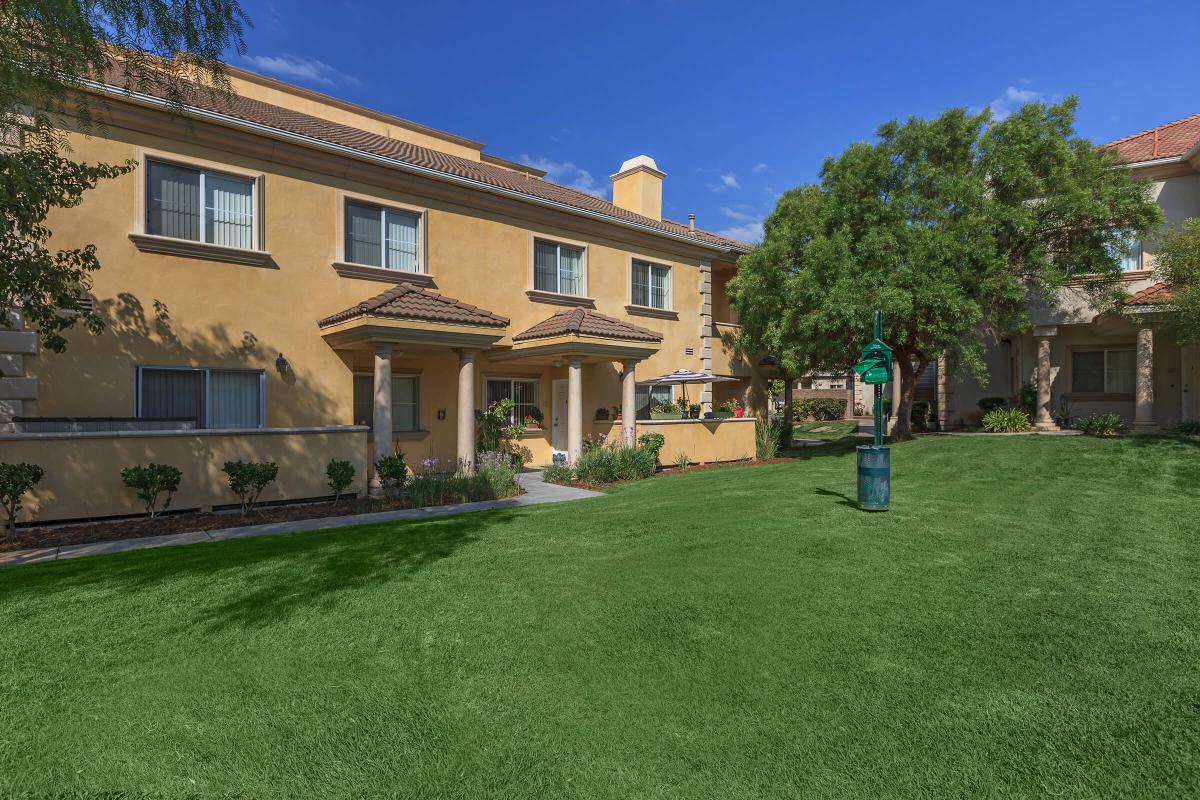 a house with a lawn in front of a building