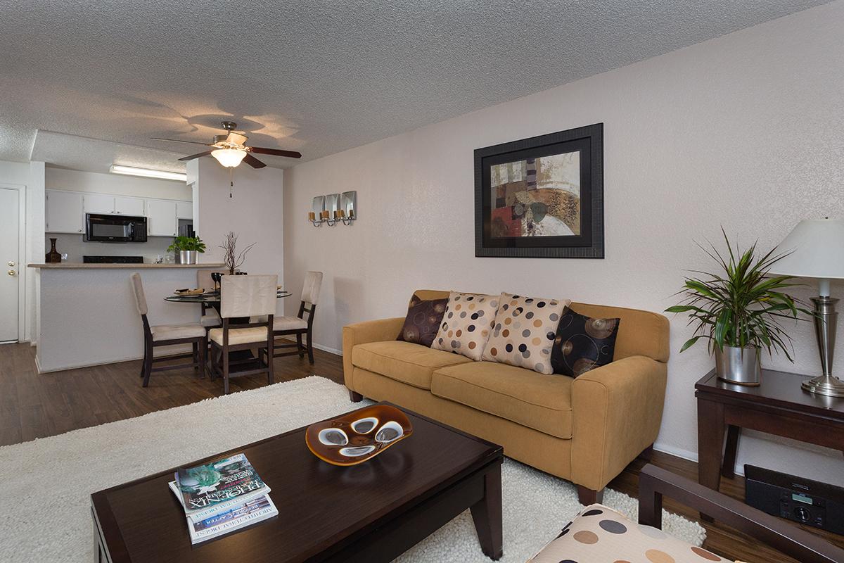 a living room filled with furniture and a flat screen tv
