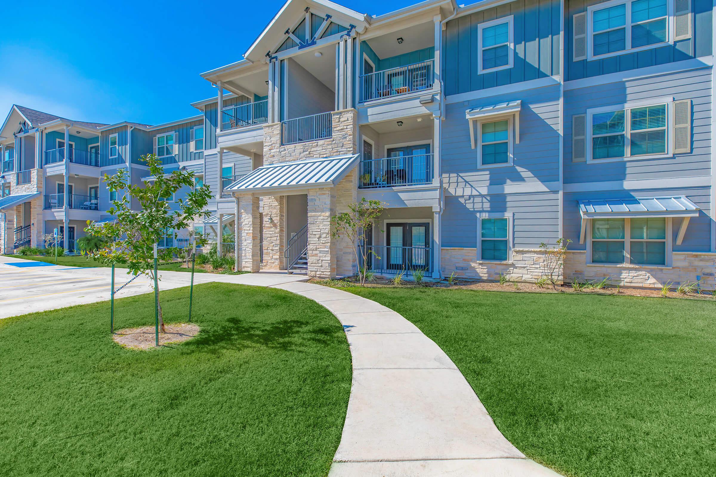 a large lawn in front of a building