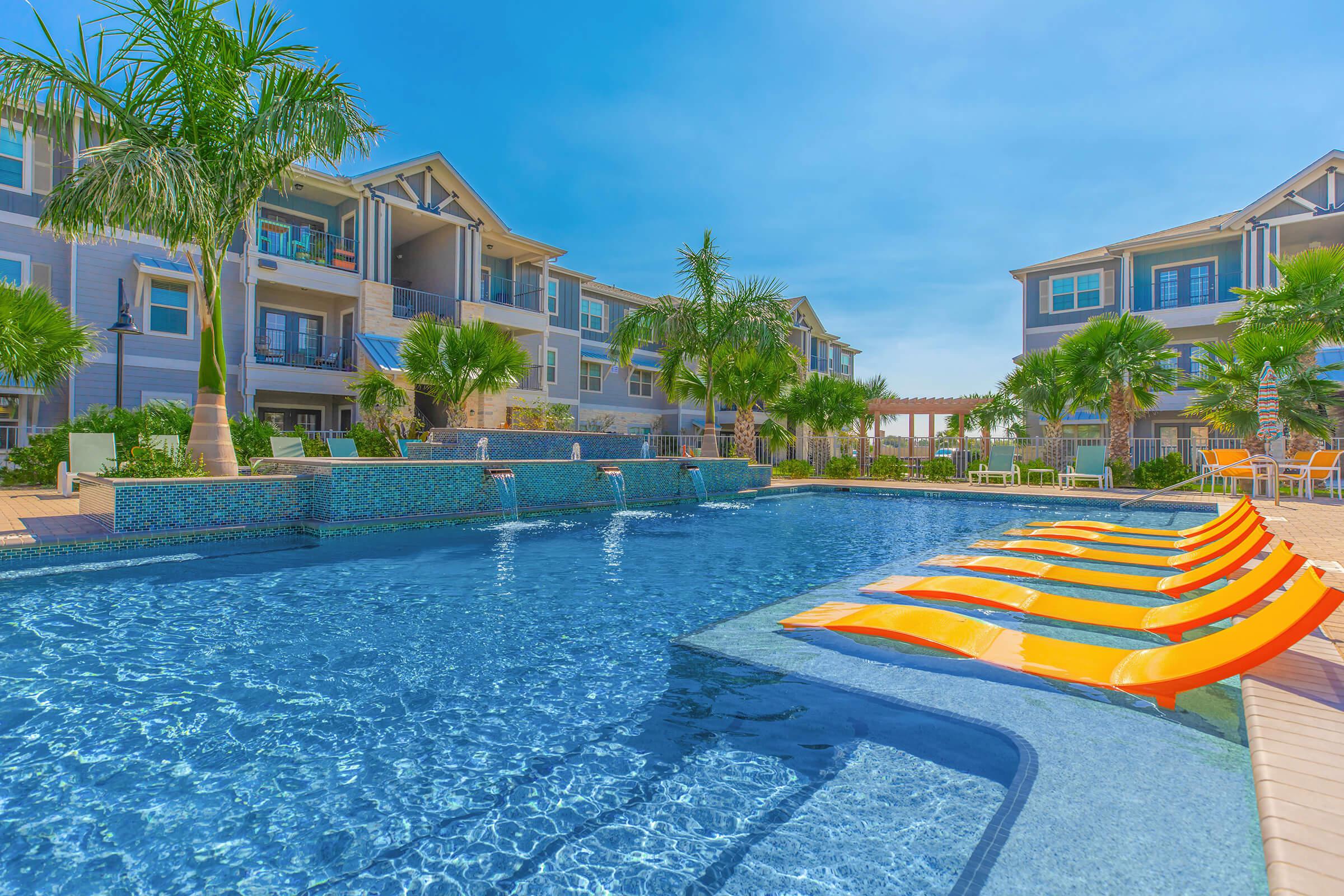 VEGAS-STYLE POOL WITH WATERFALL