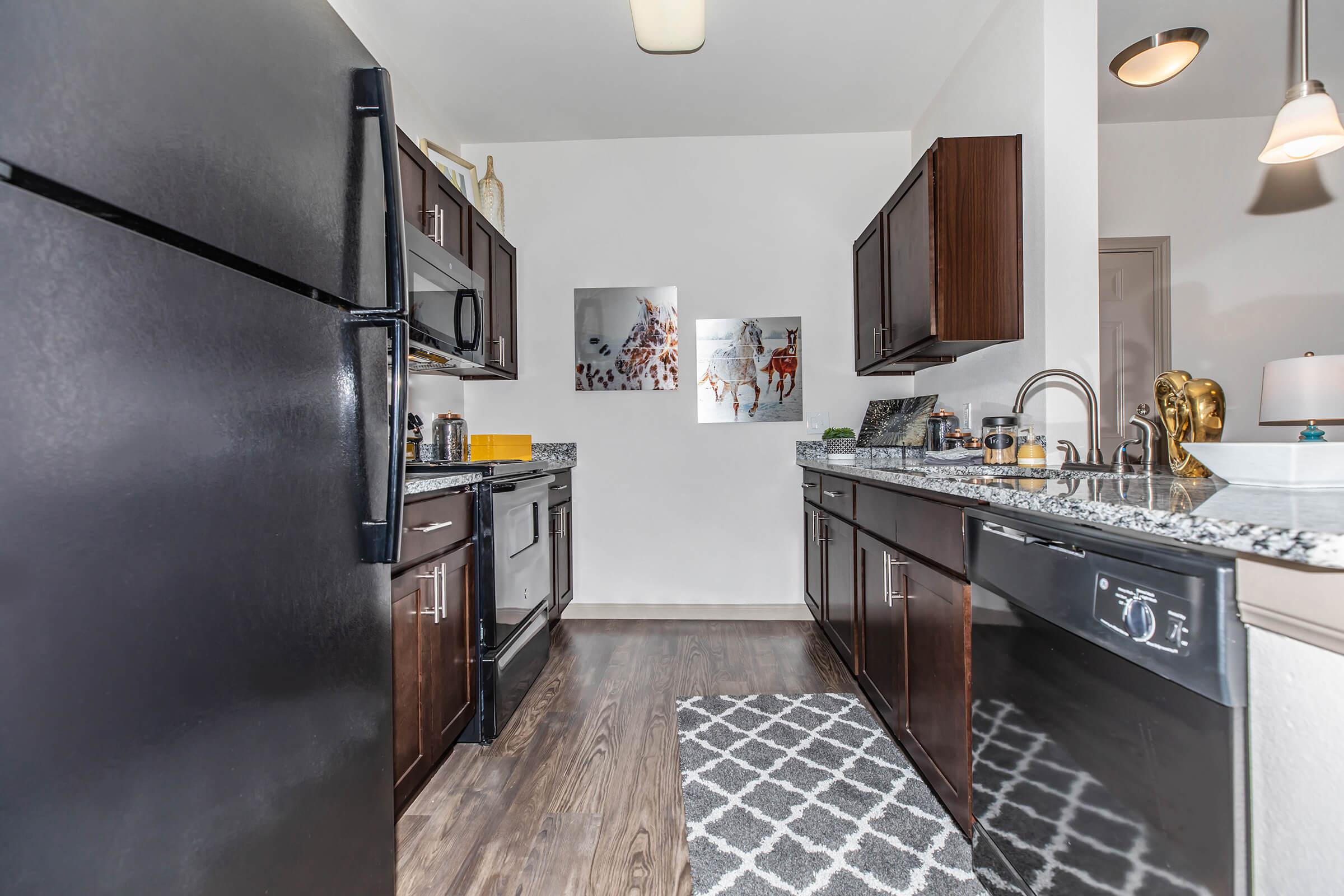 a modern kitchen with stainless steel appliances