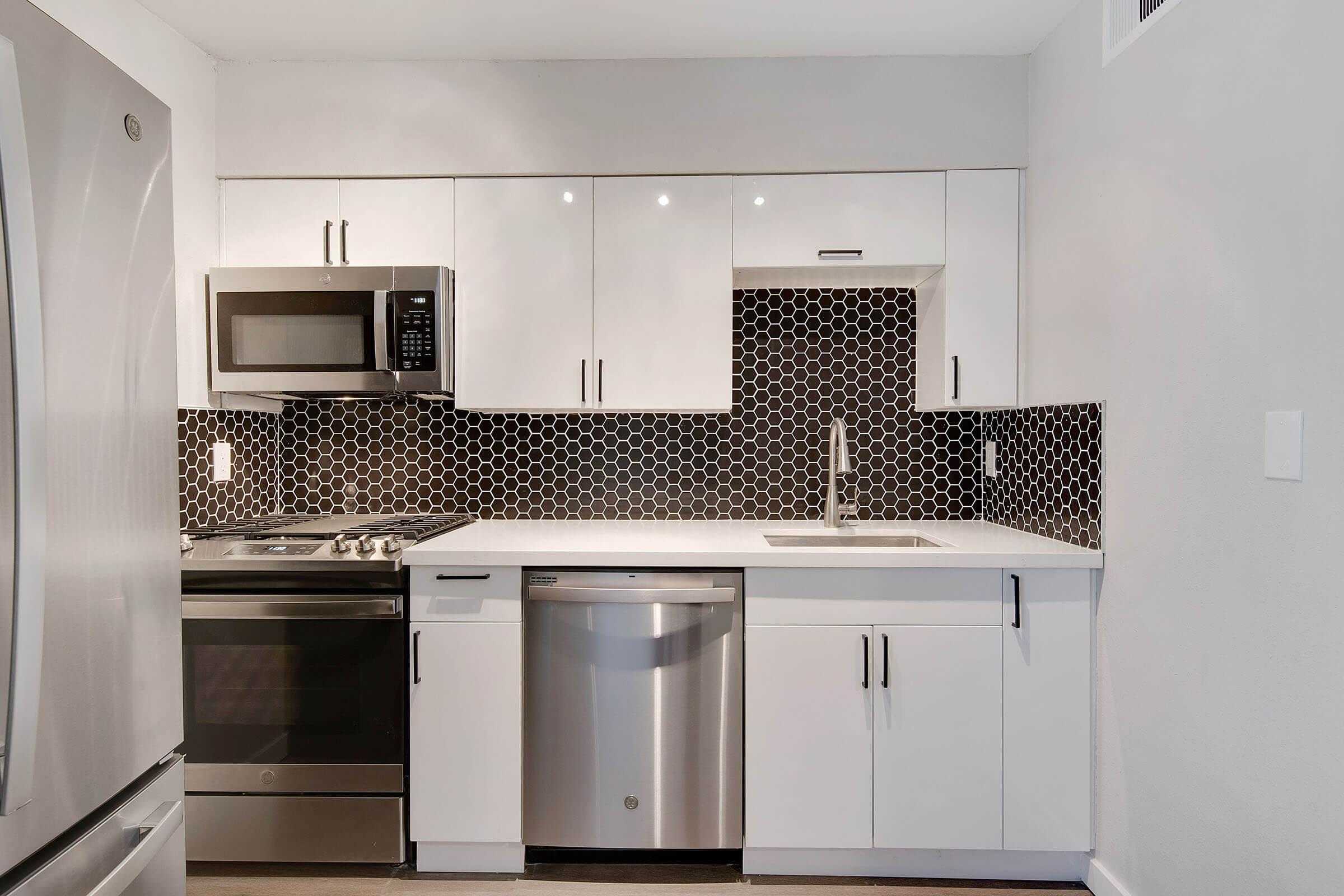 a kitchen with a stove top oven sitting inside of a refrigerator