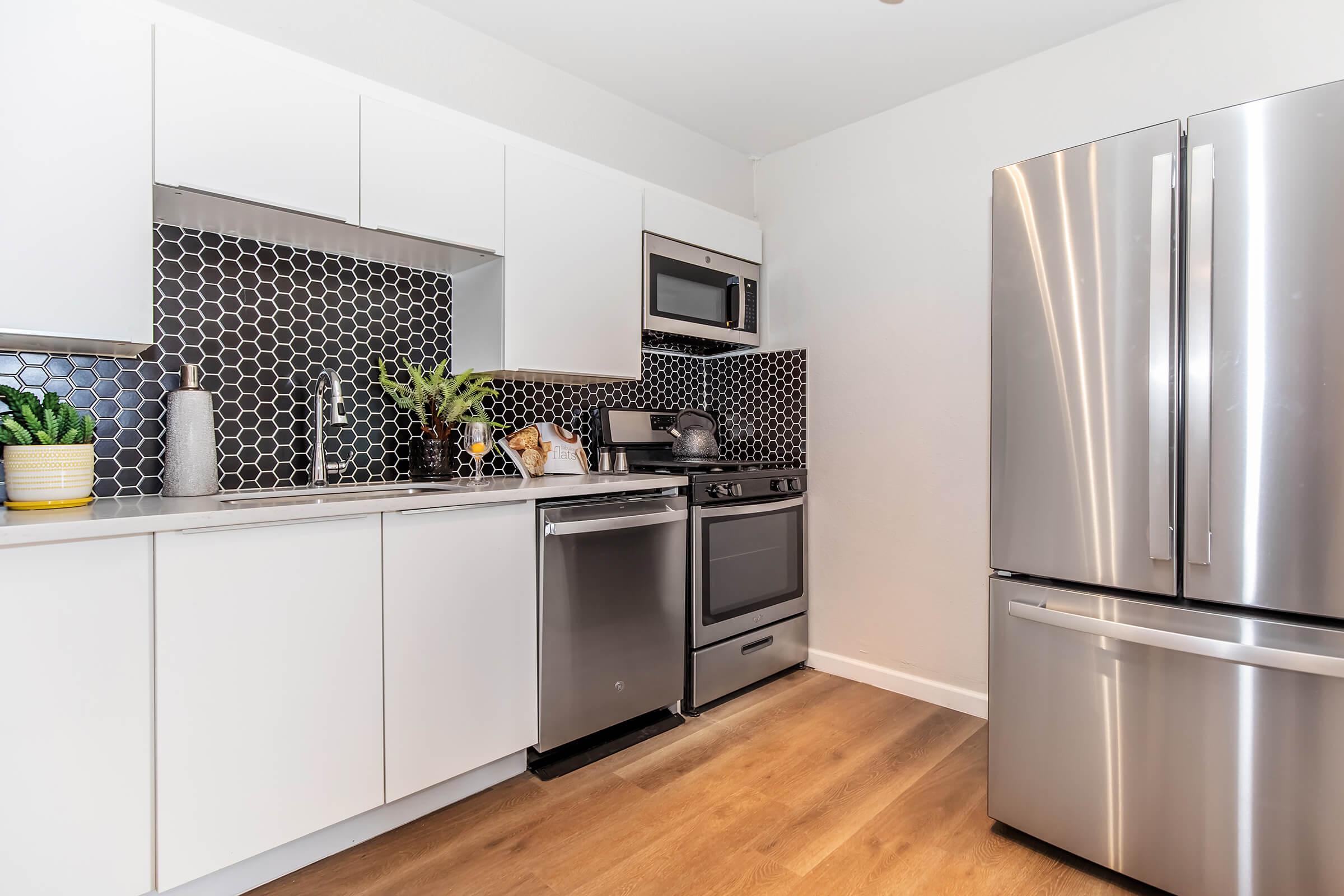 a stainless steel refrigerator in a kitchen