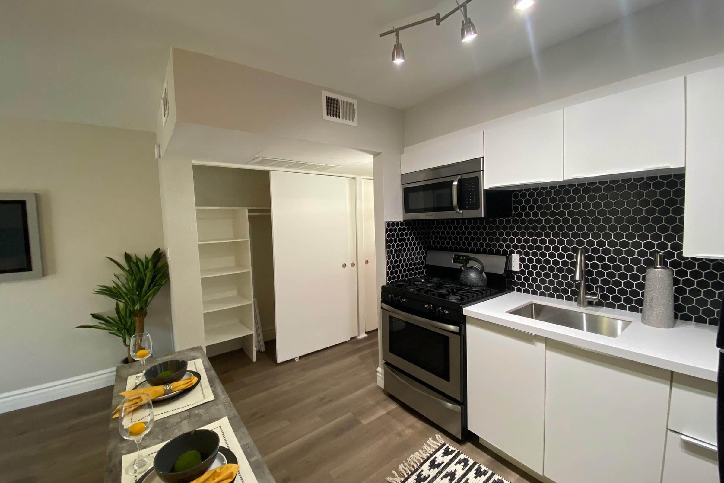 a modern kitchen with stainless steel appliances