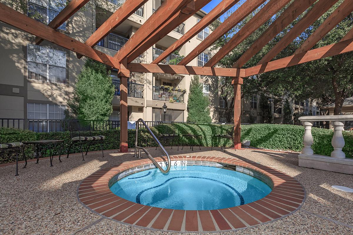 a pool next to a brick building