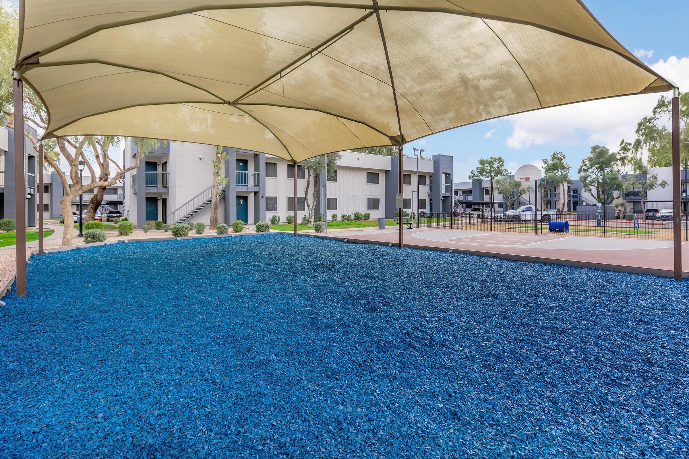 a large blue umbrella in the rain