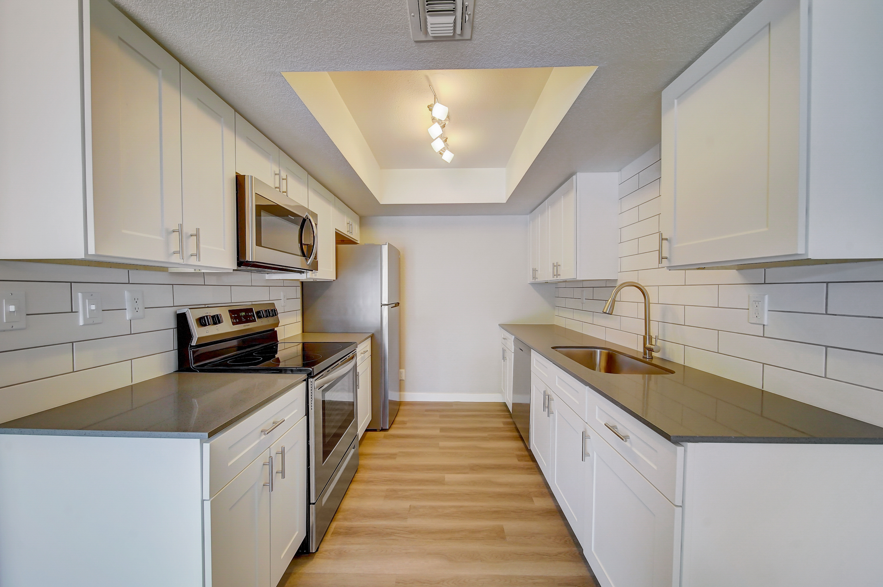 a kitchen with a stove top oven