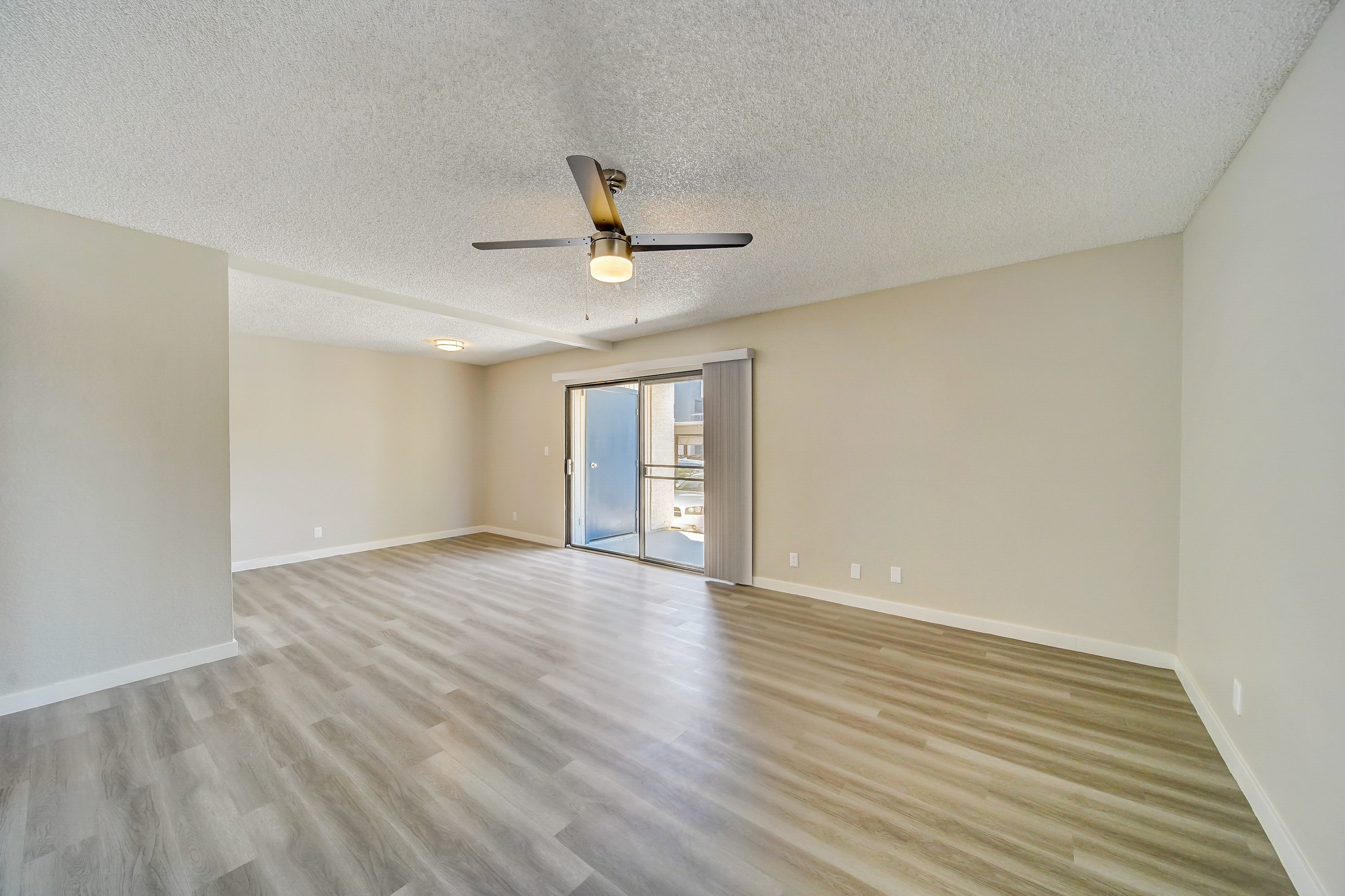 a large empty room with a wooden floor