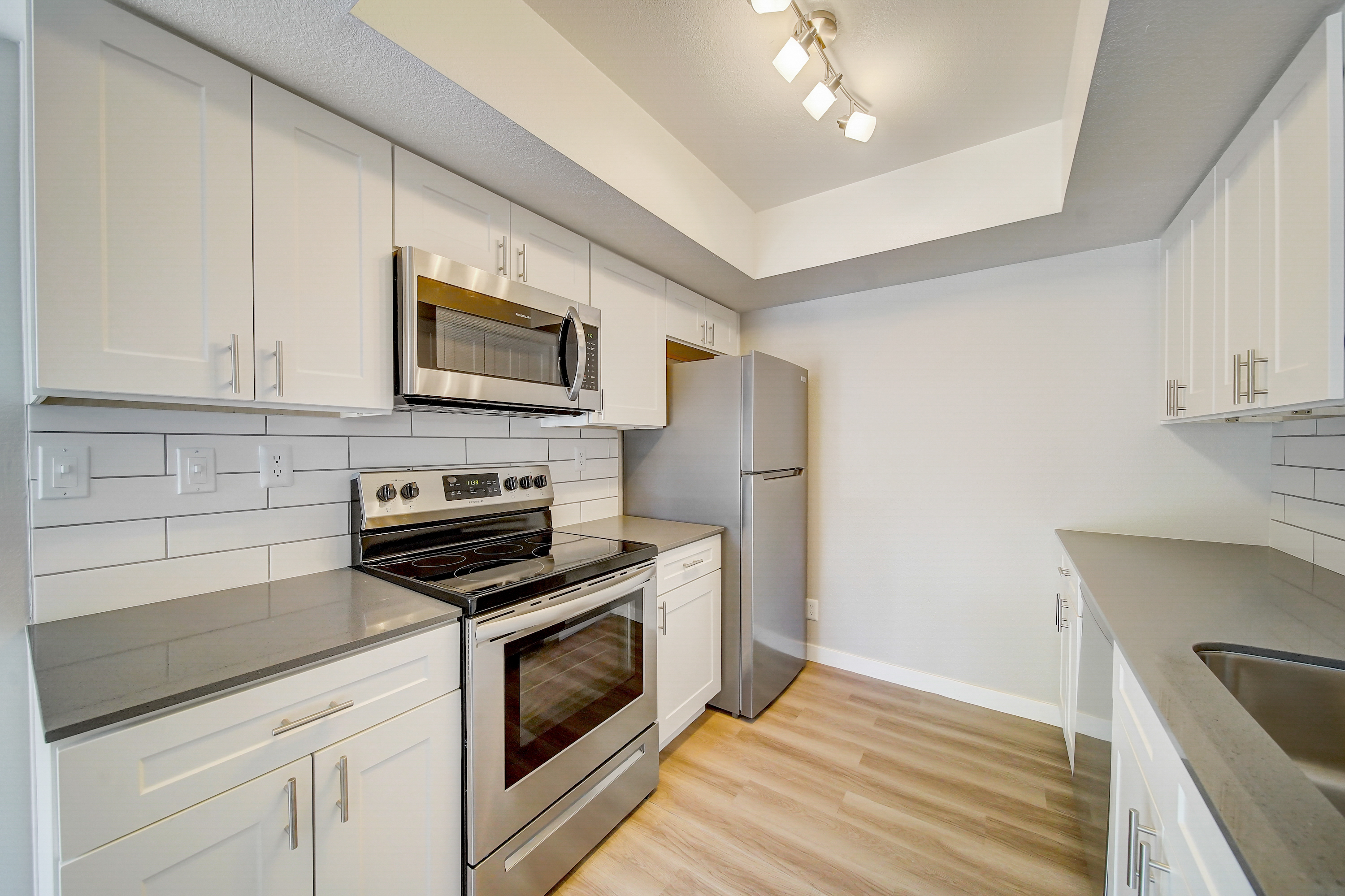 a kitchen with a stove top oven