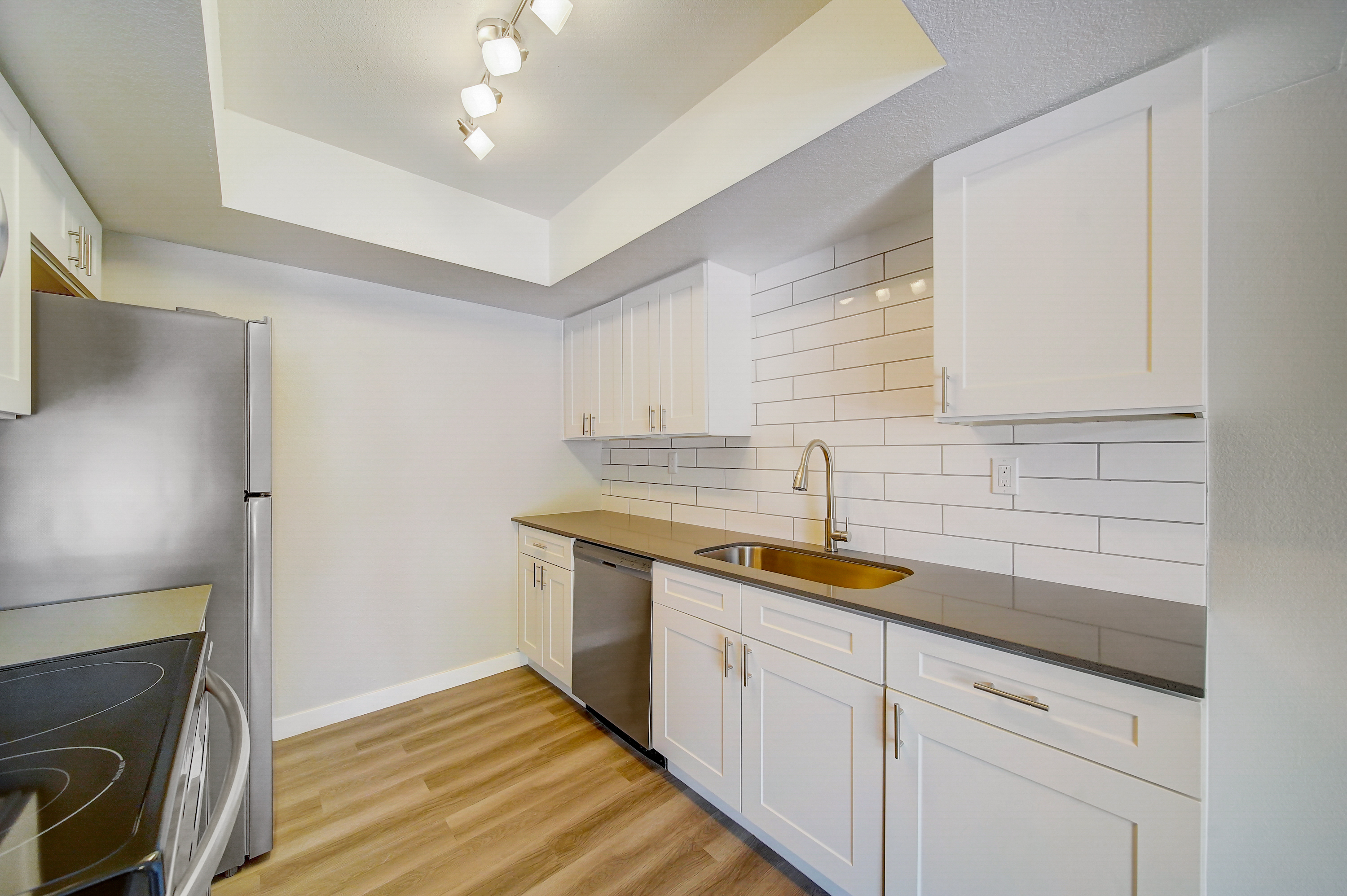 a kitchen with a sink and a microwave