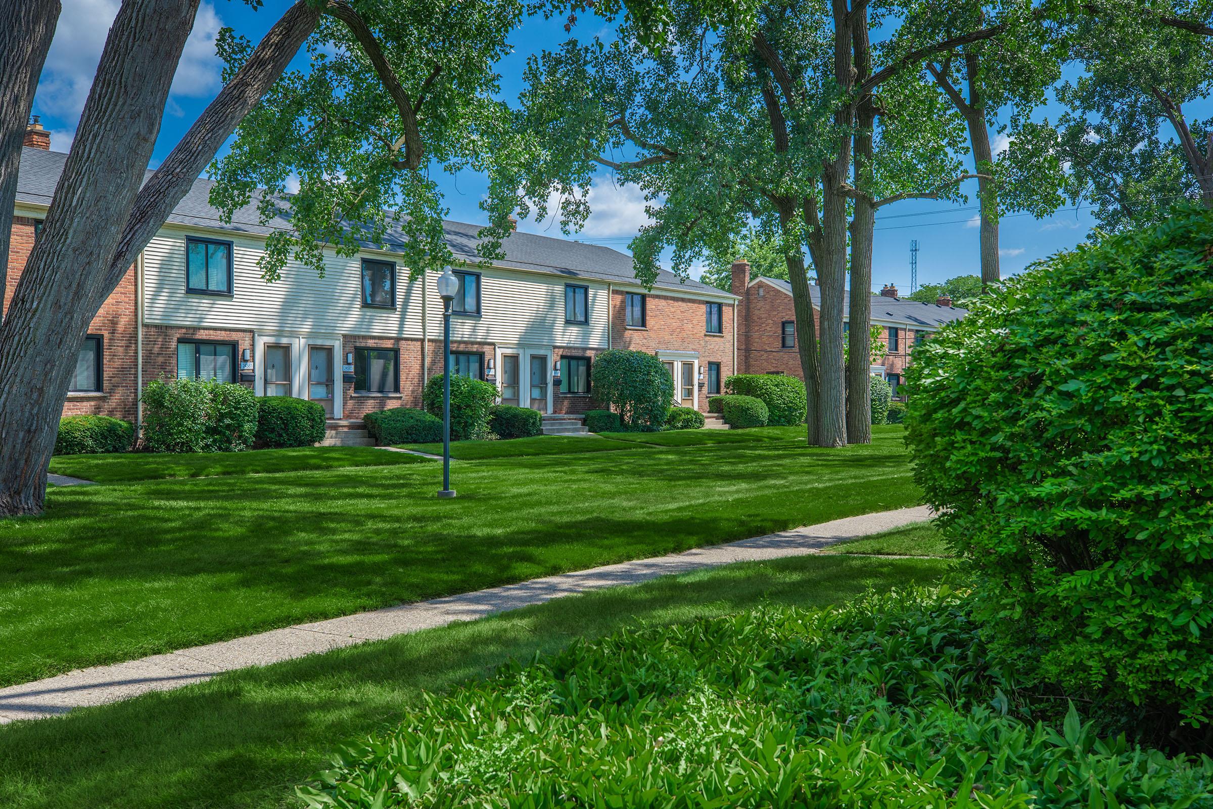 a tree in front of a house