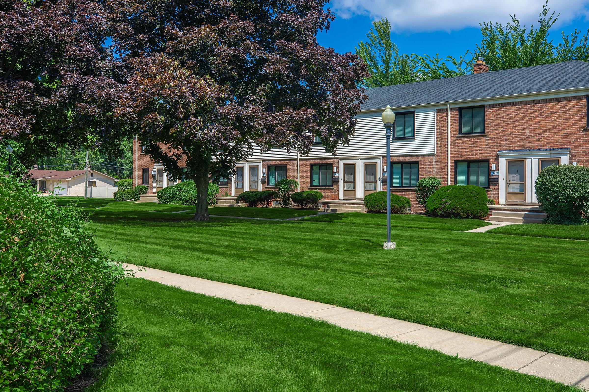 a large lawn in front of a house