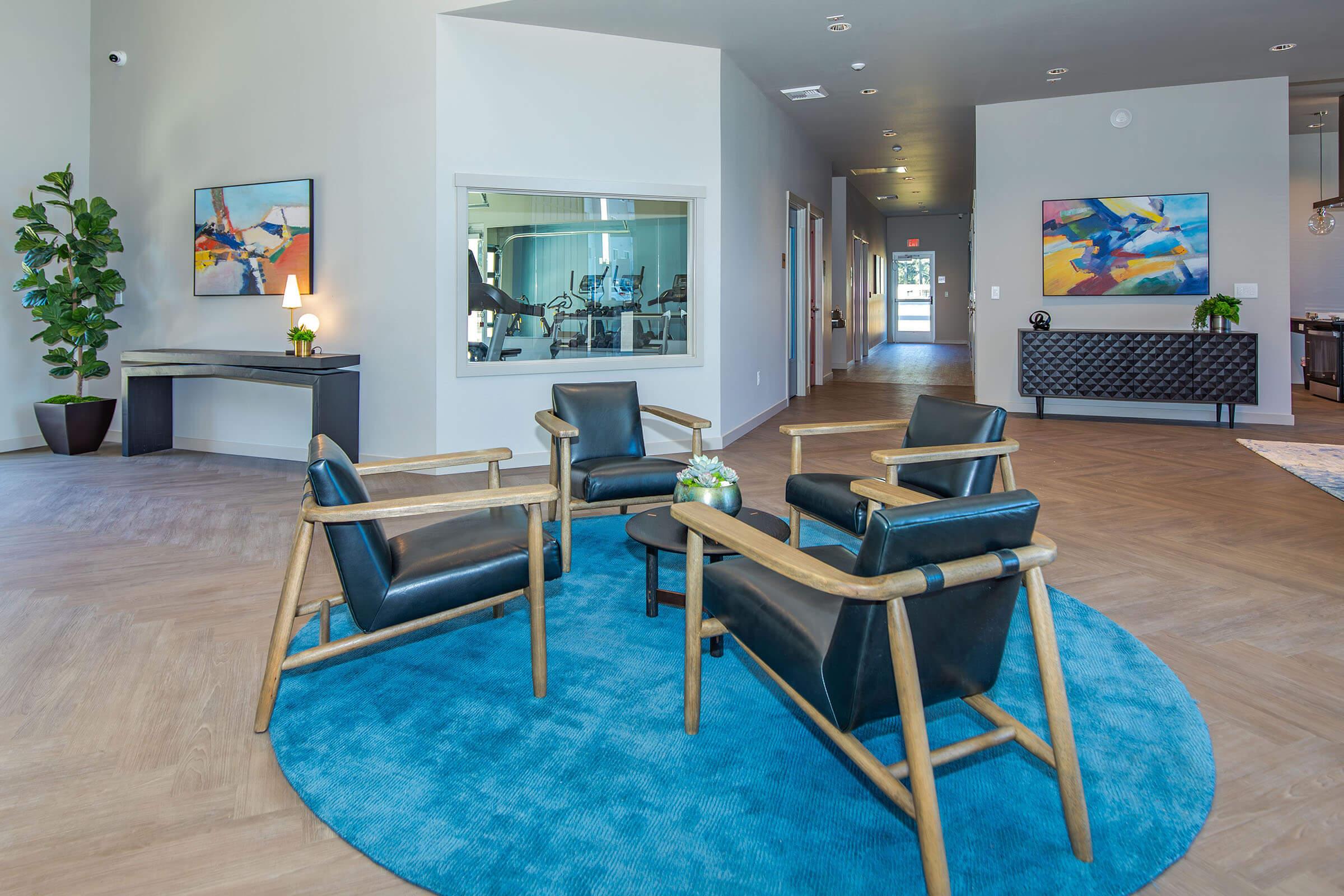 a room filled with furniture and a blue chair