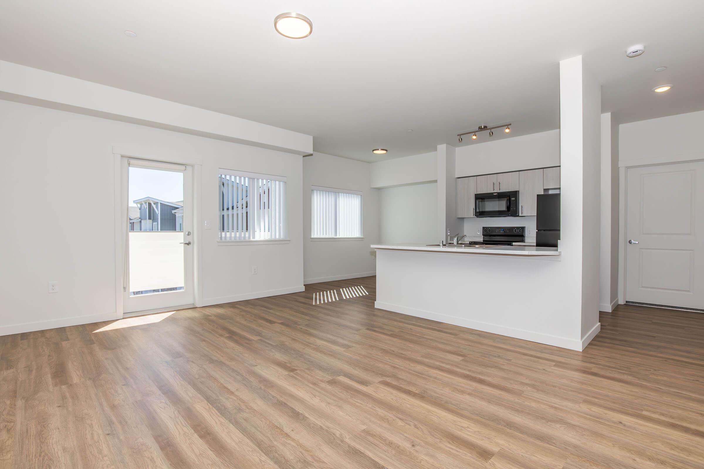 a kitchen with a wood floor