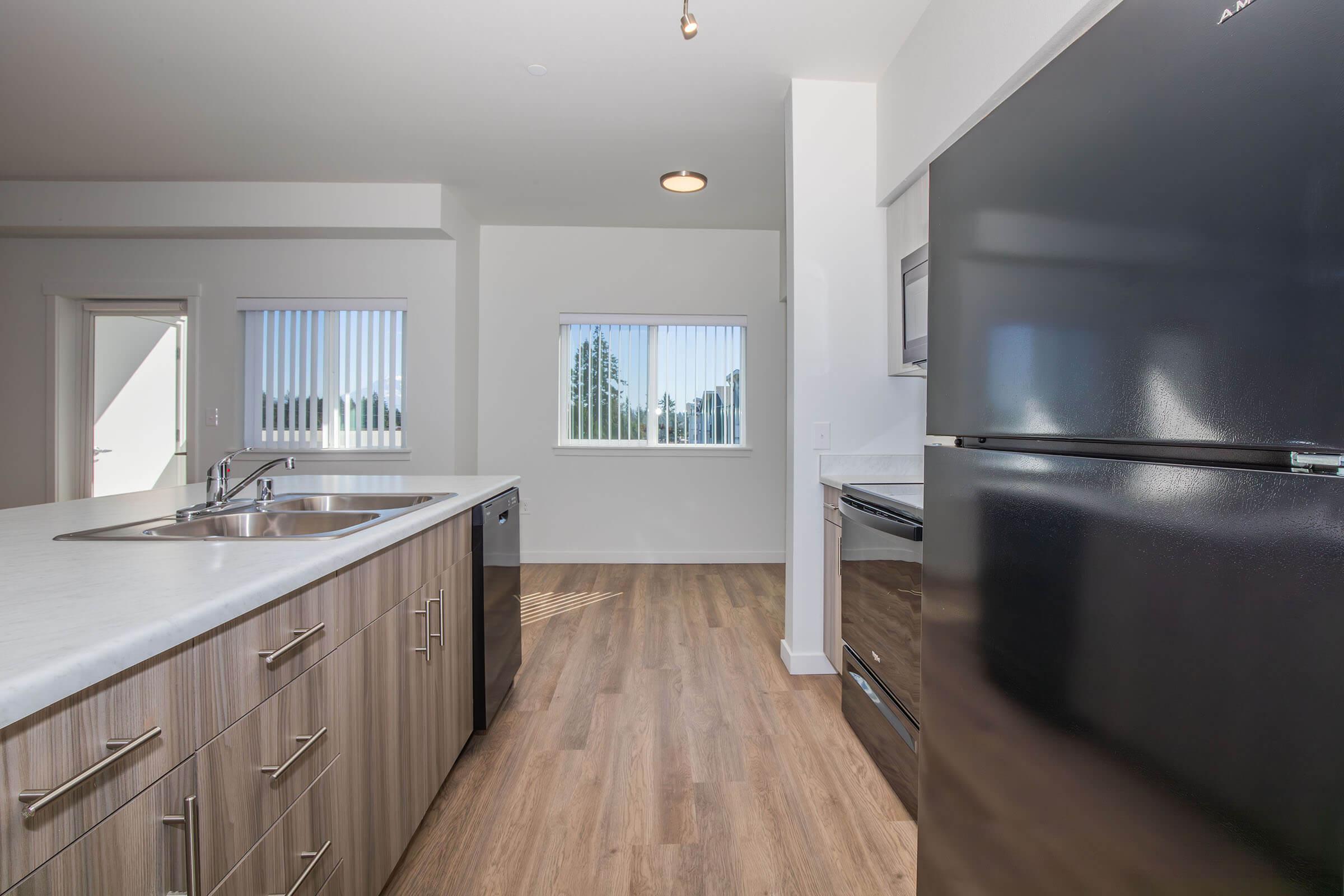 a kitchen with a sink and a window