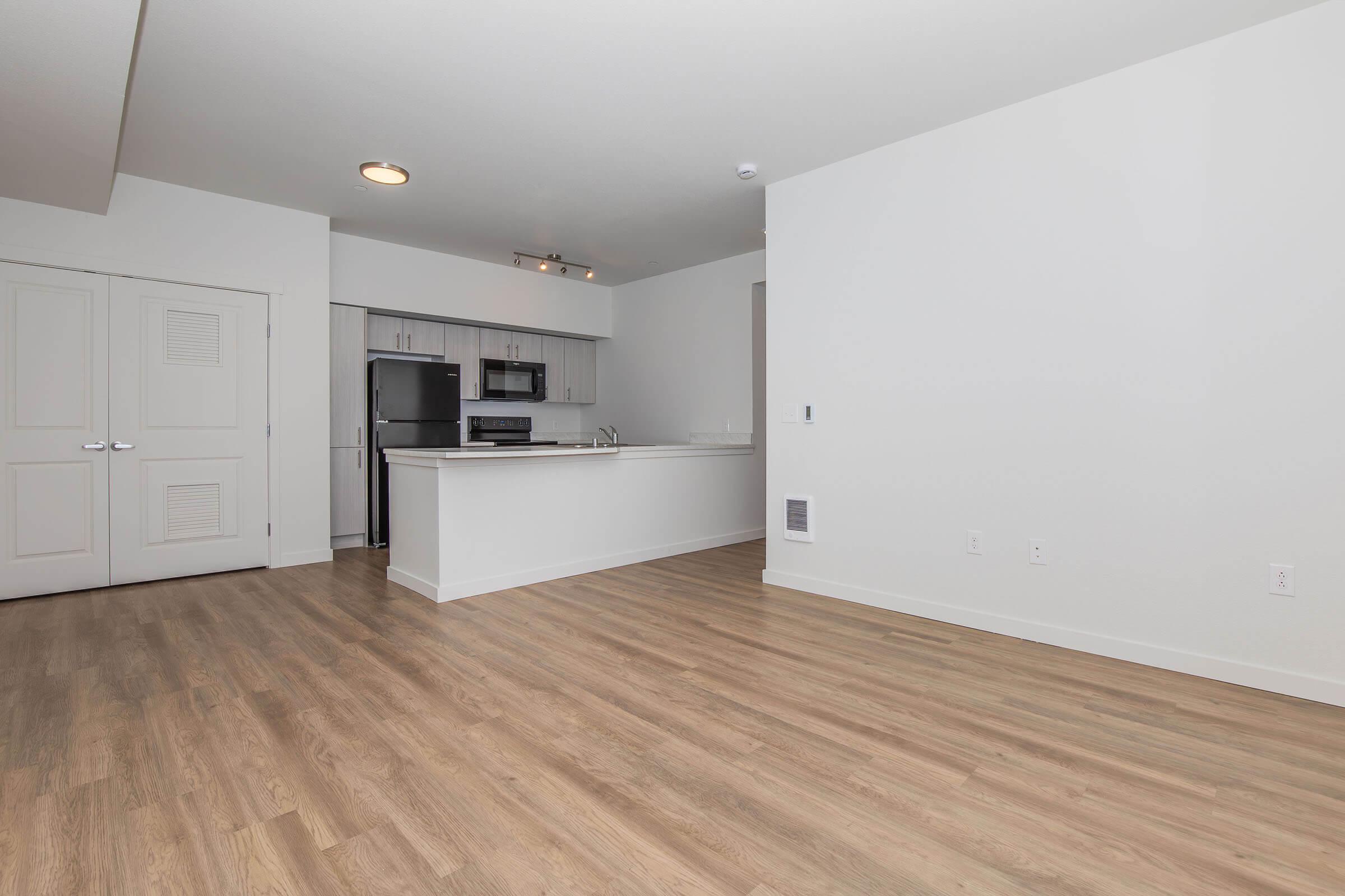 a kitchen with a wood floor