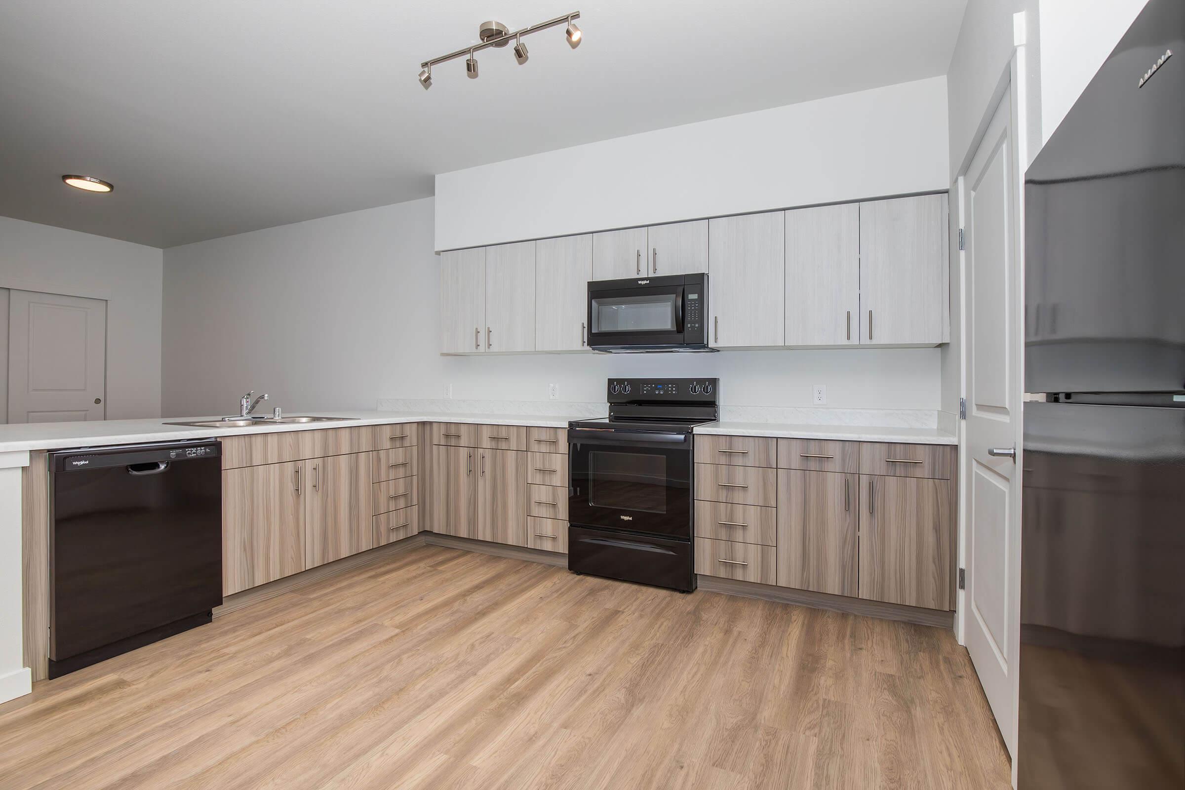 a kitchen with a wood floor