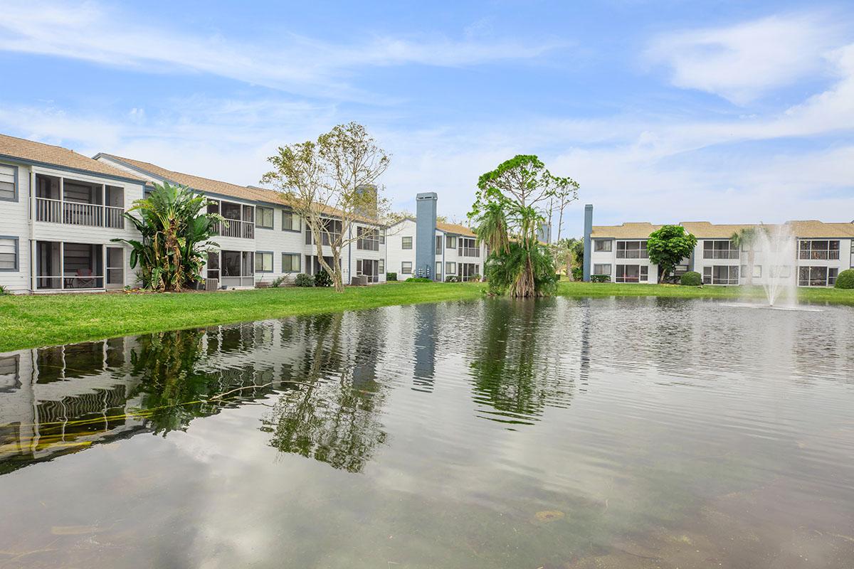 a building next to a body of water