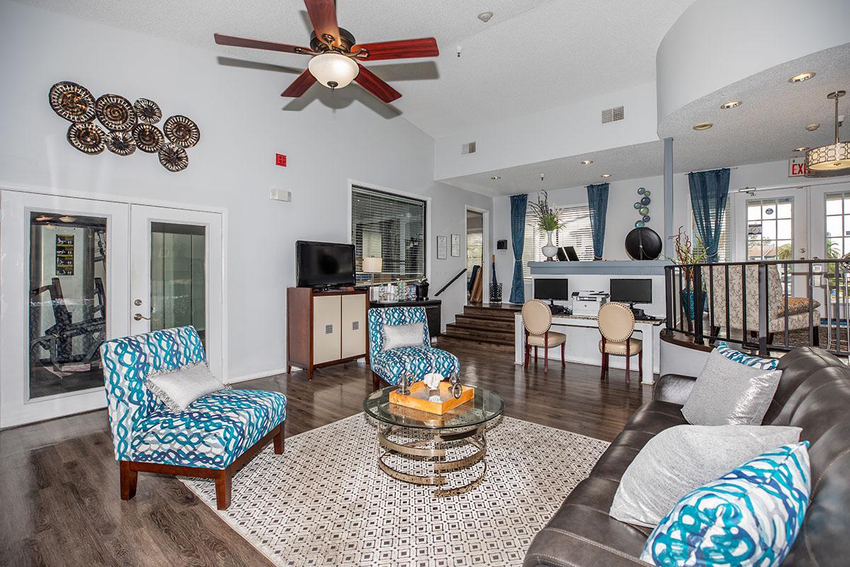 a living room filled with furniture and a fire place