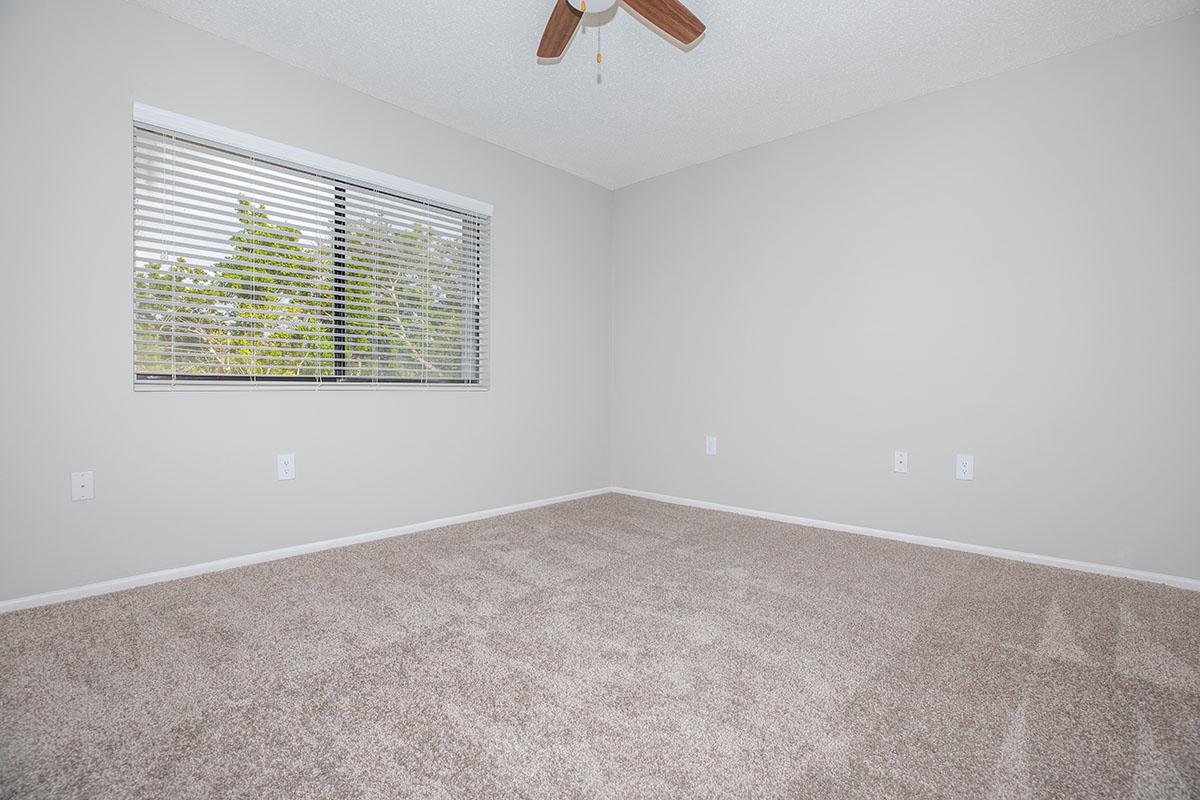 a bedroom with a large window