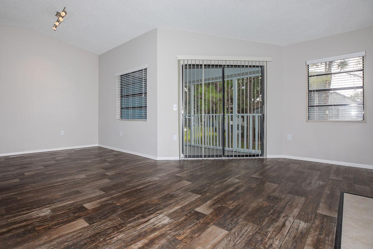 a large empty room with a wooden floor