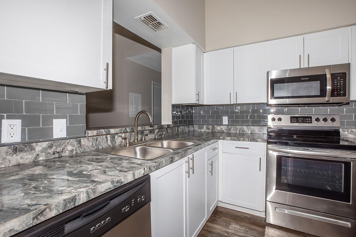 a kitchen with a stove top oven