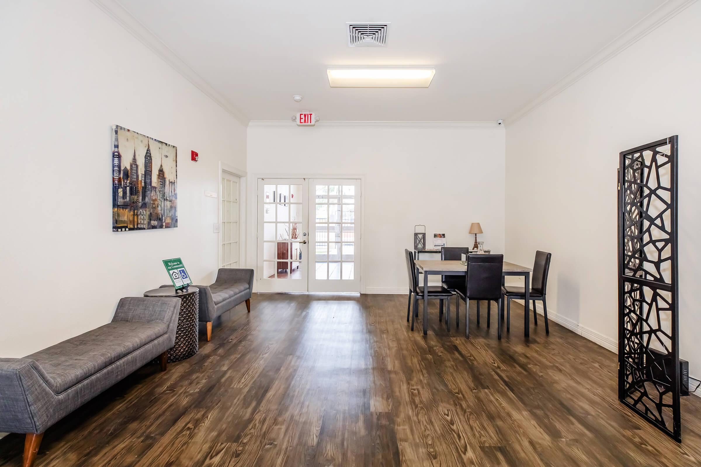 a view of a living room with a wooden floor