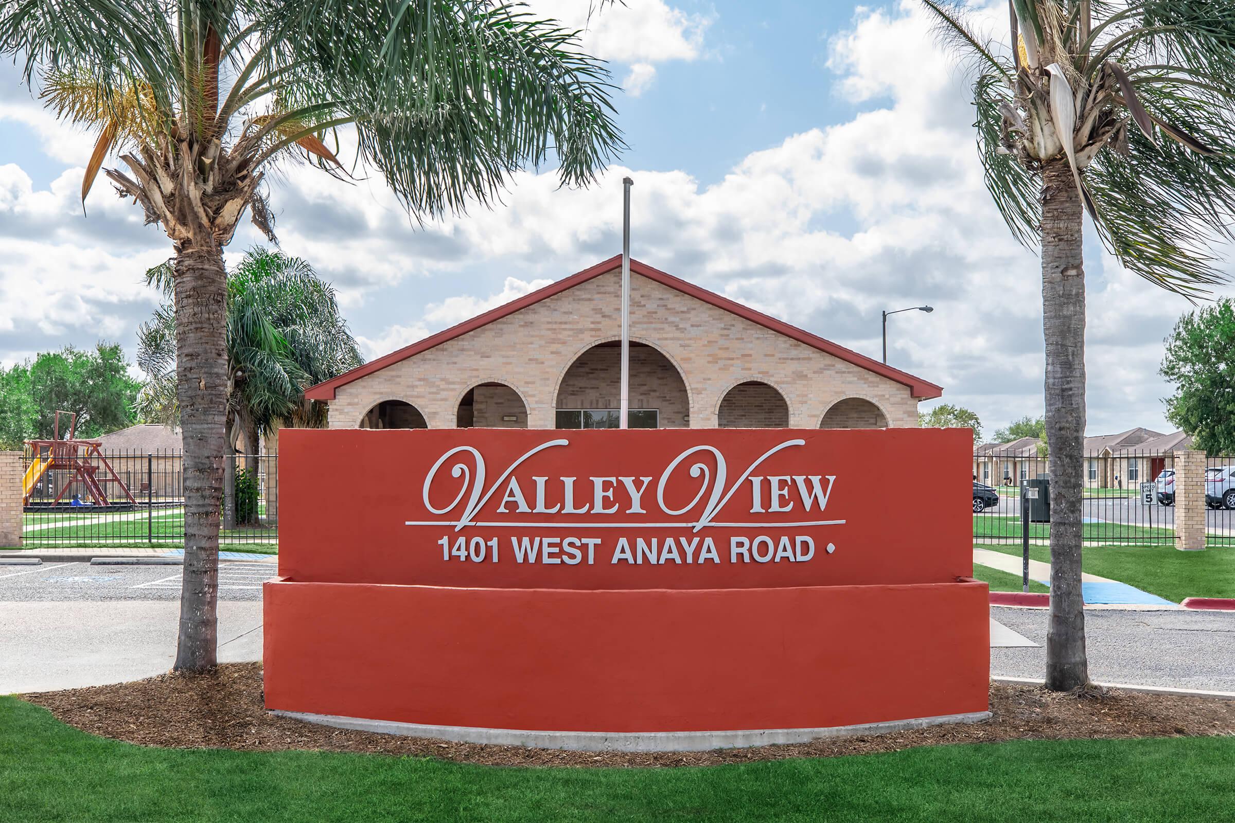 a large lawn in front of a sign