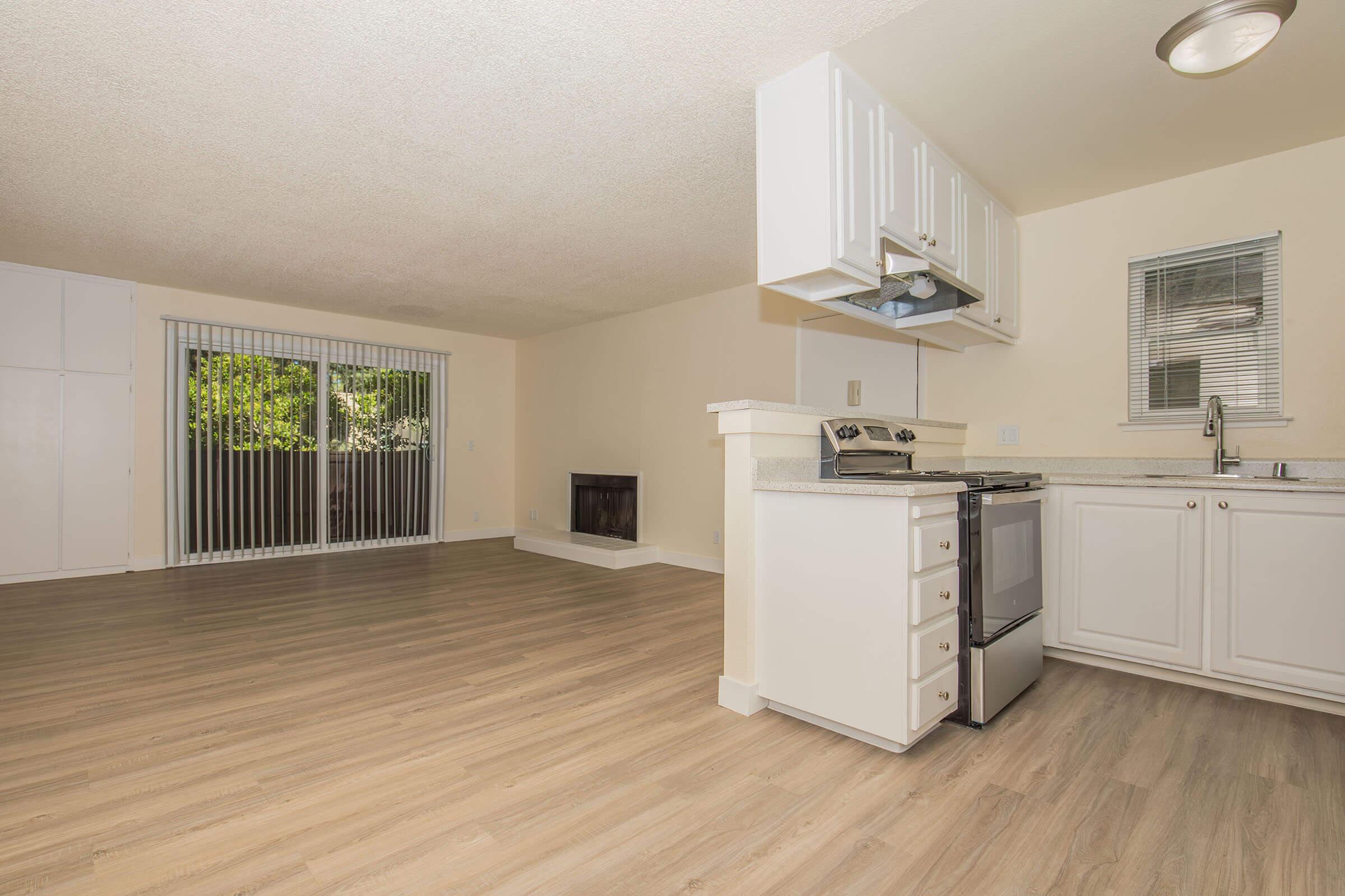 a kitchen with a wooden floor