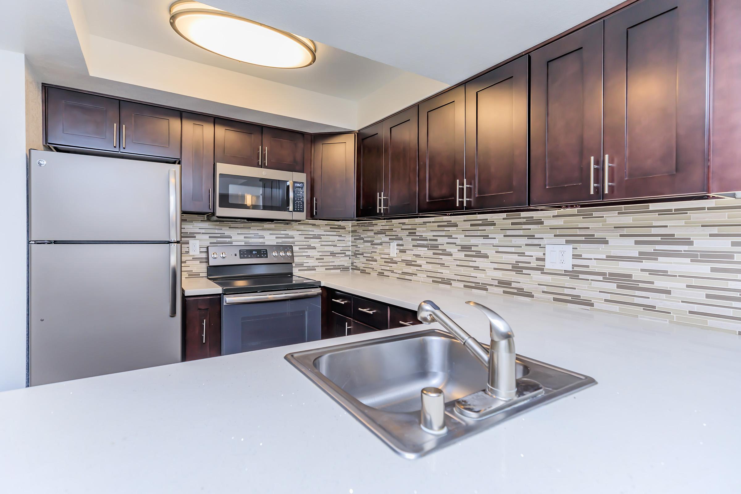 a modern kitchen with stainless steel appliances