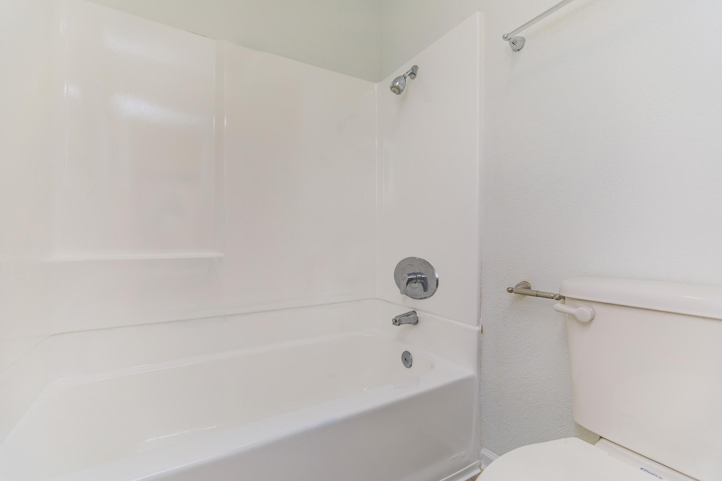 a room with a tub and shower