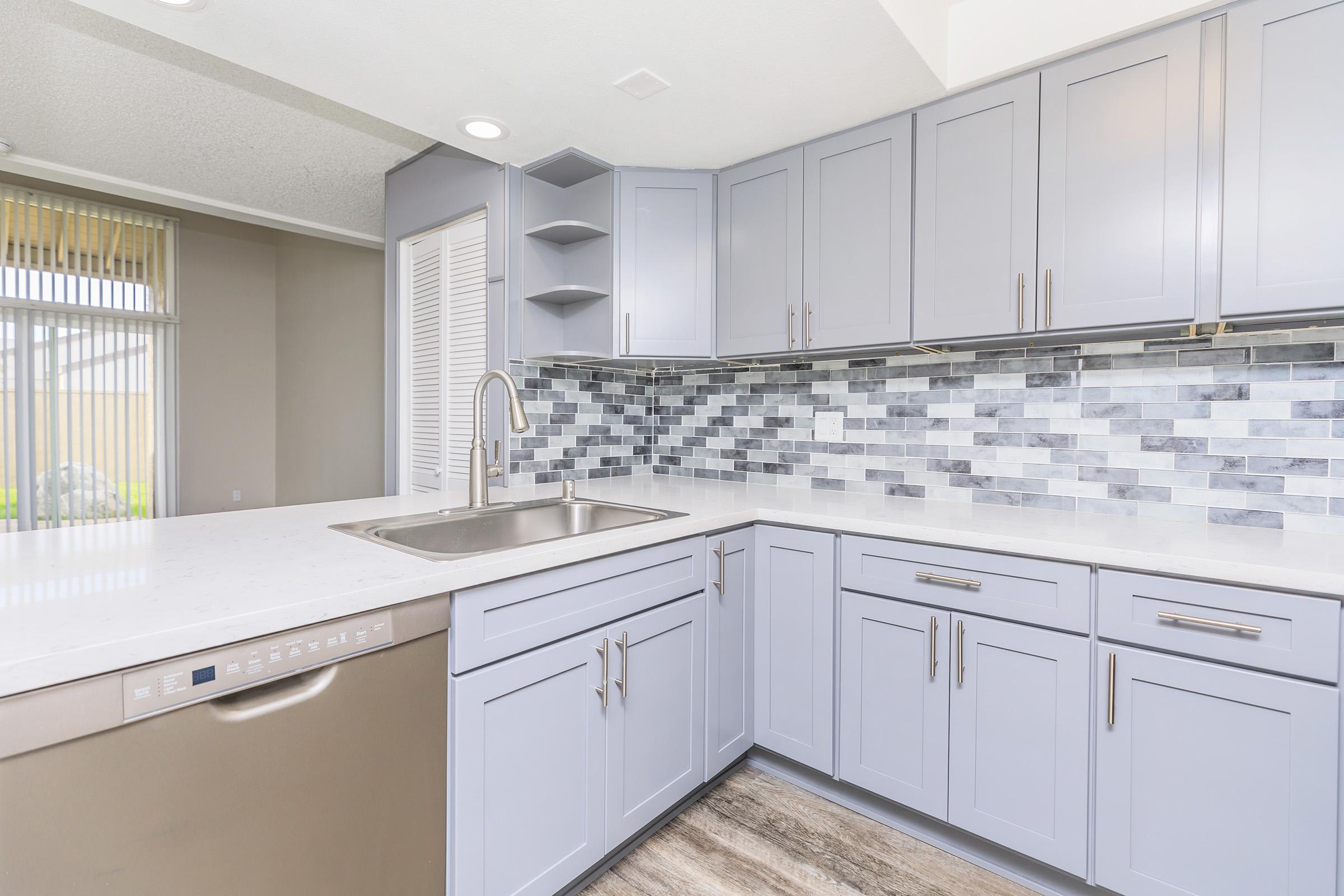 a kitchen with a sink and a window