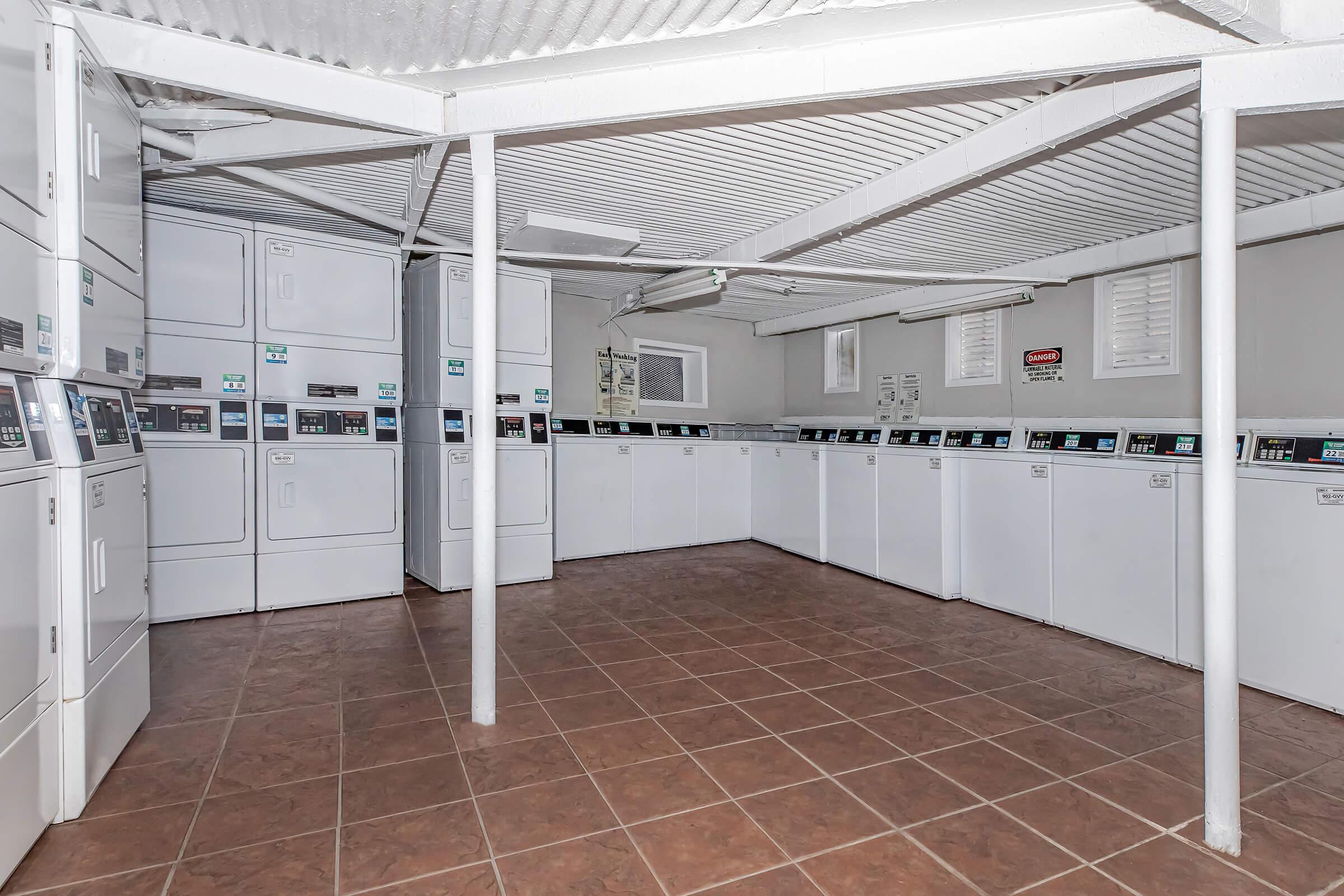 a kitchen area with a building in the background