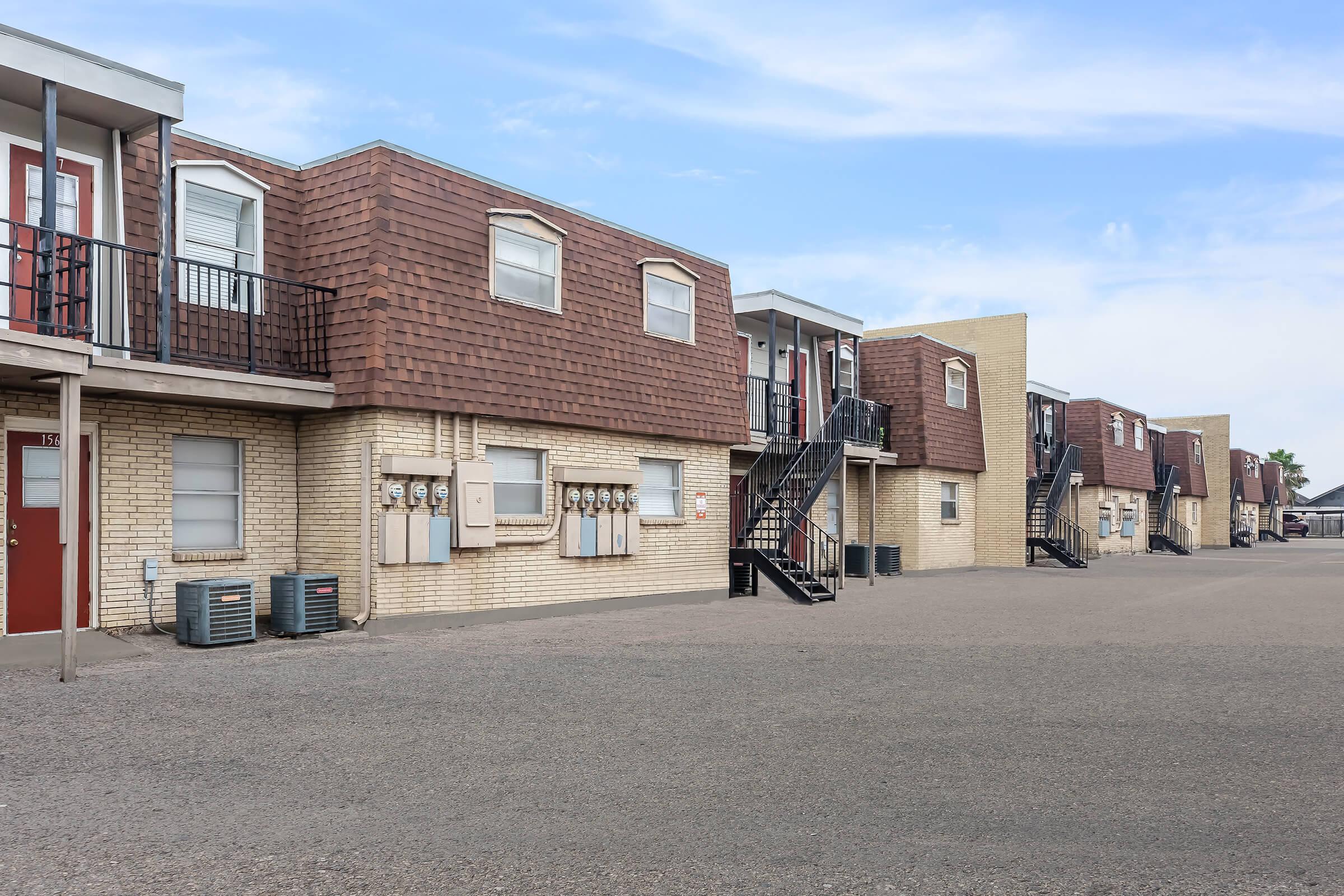 a close up of a street in front of a brick building