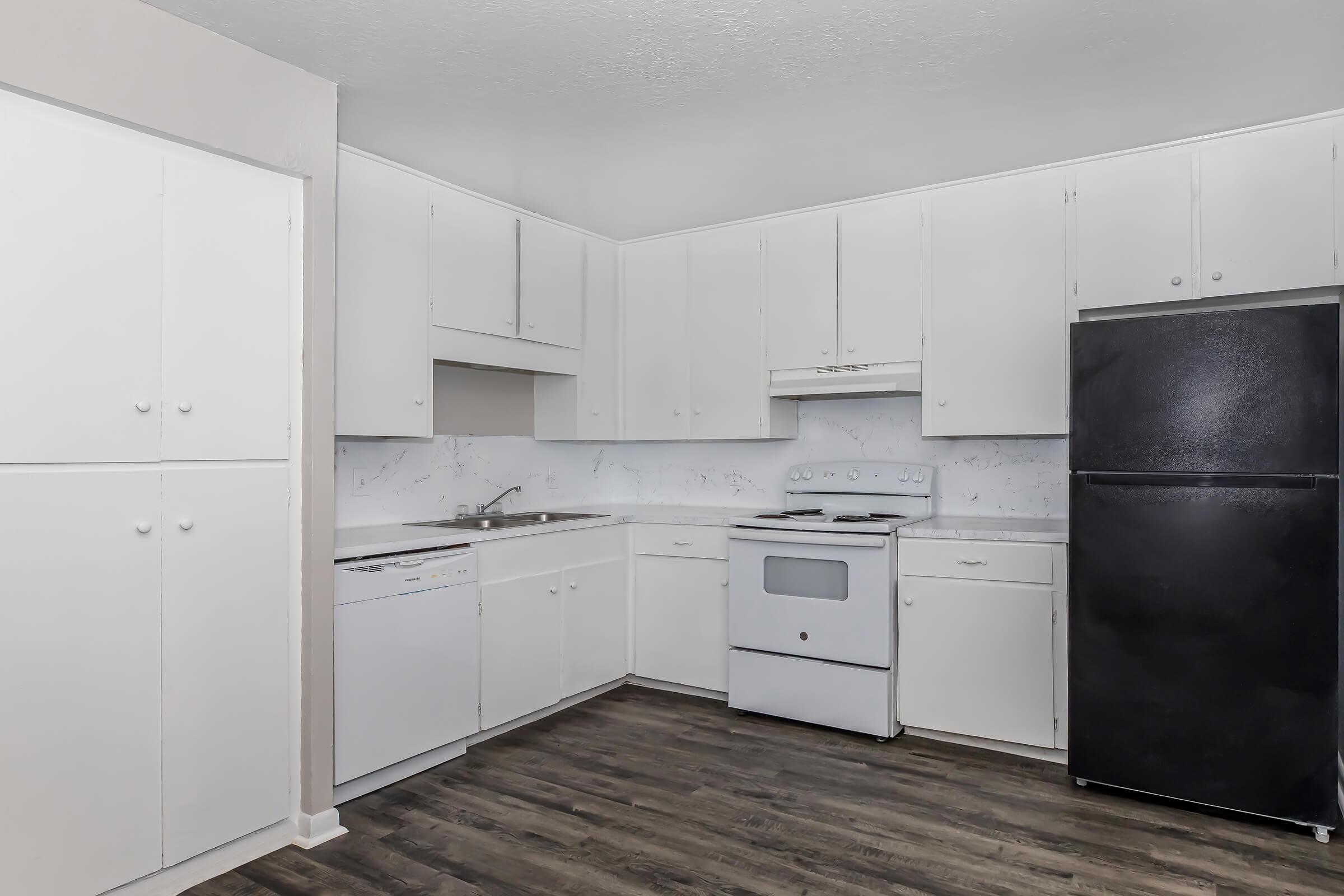 a kitchen with a stove and a refrigerator