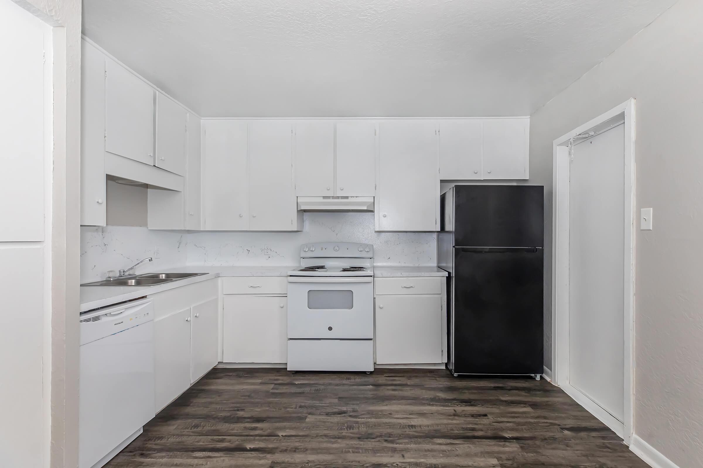 a kitchen with a stove and a refrigerator