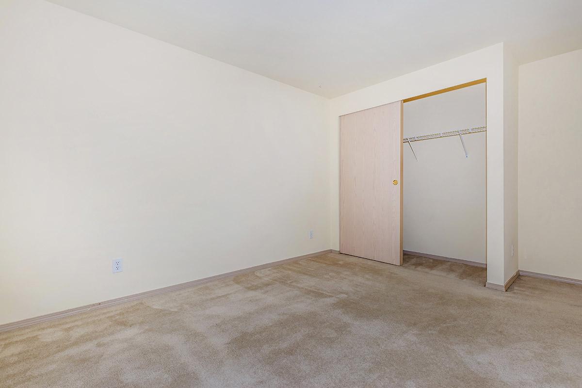 a bedroom with a bed in a room