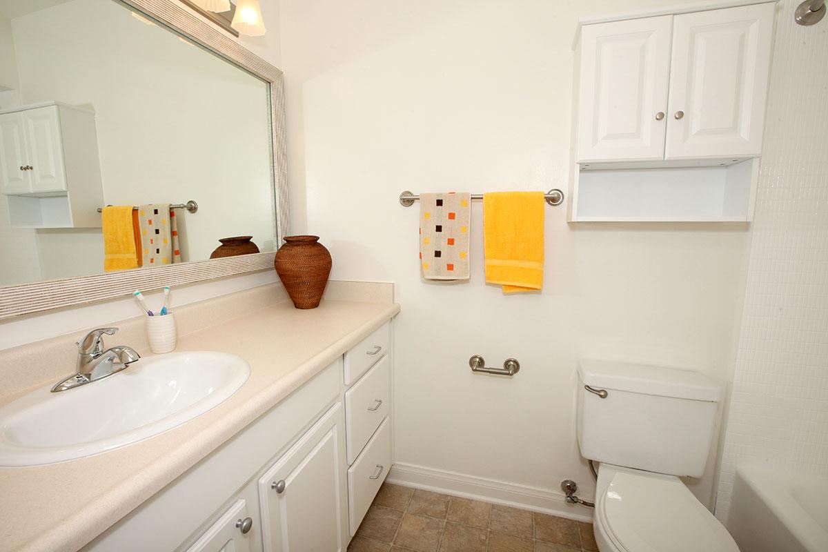 a kitchen with a sink and a mirror
